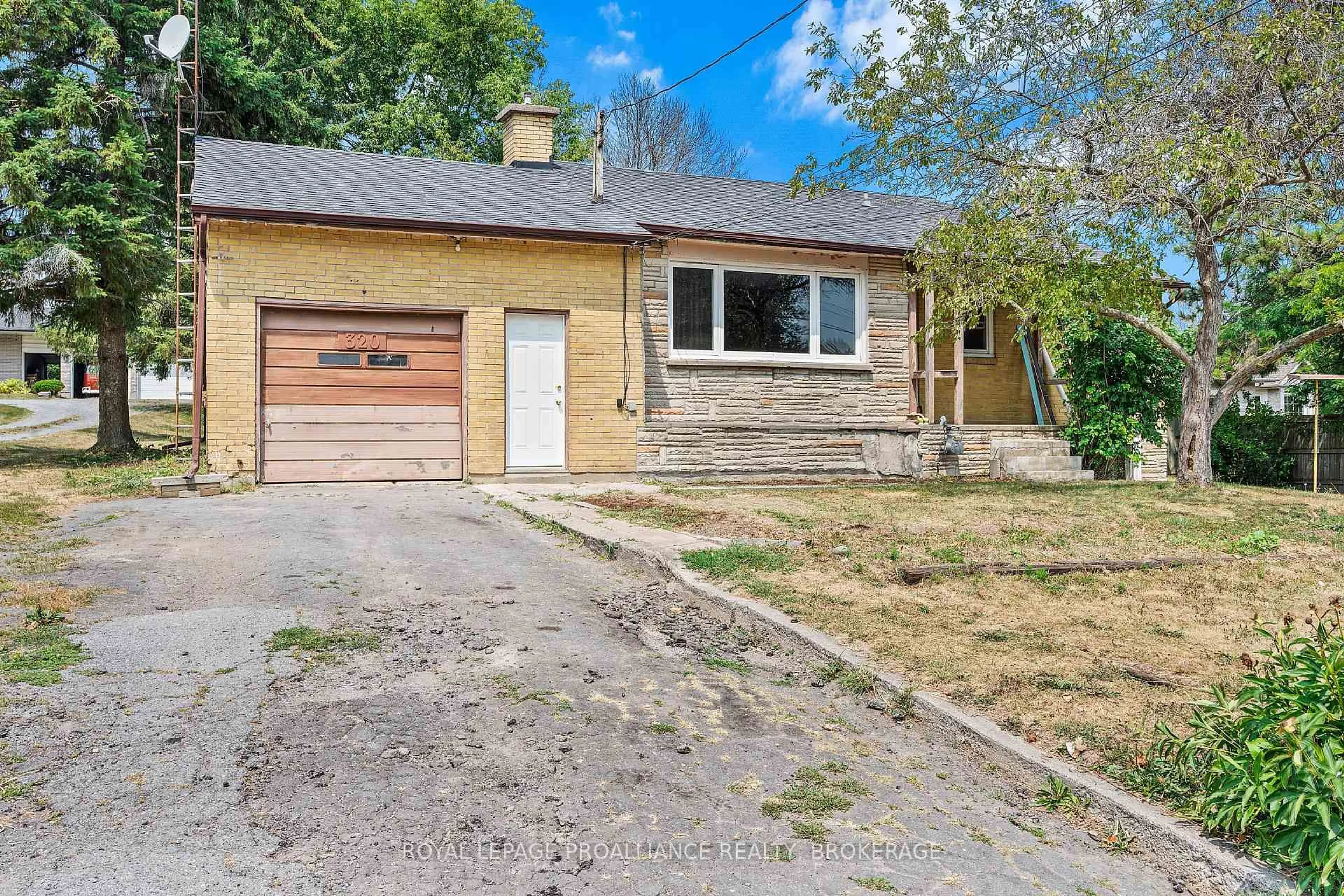 Home with brick exterior material, street for 320 Academy St, Bath Ontario K0H 1G0