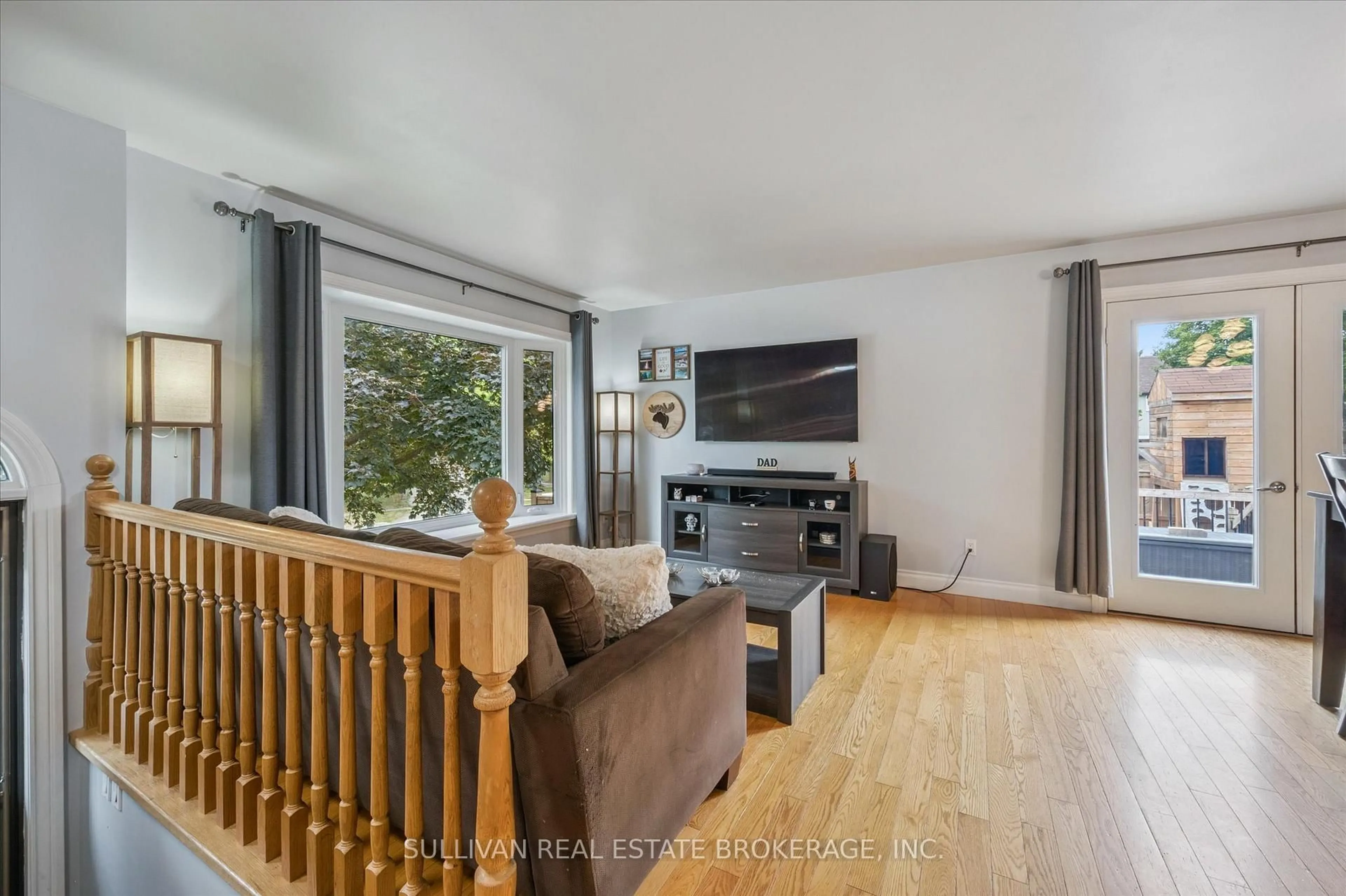 Living room with furniture, wood/laminate floor for 95 Heather Ave, Cambridge Ontario N3C 3C1