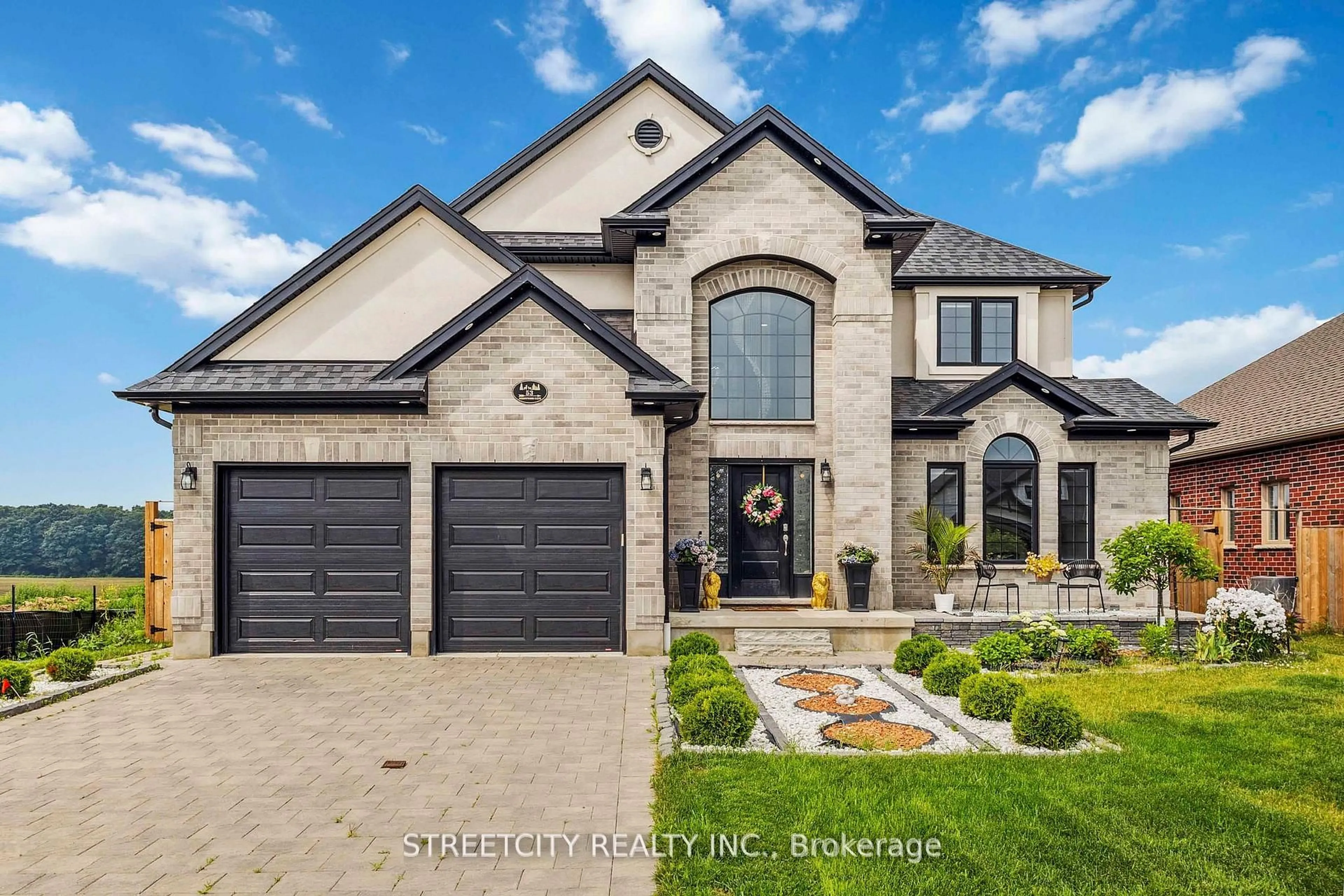 Home with brick exterior material, street for 53 Arrowwood Path, Middlesex Centre Ontario N0M 2A0