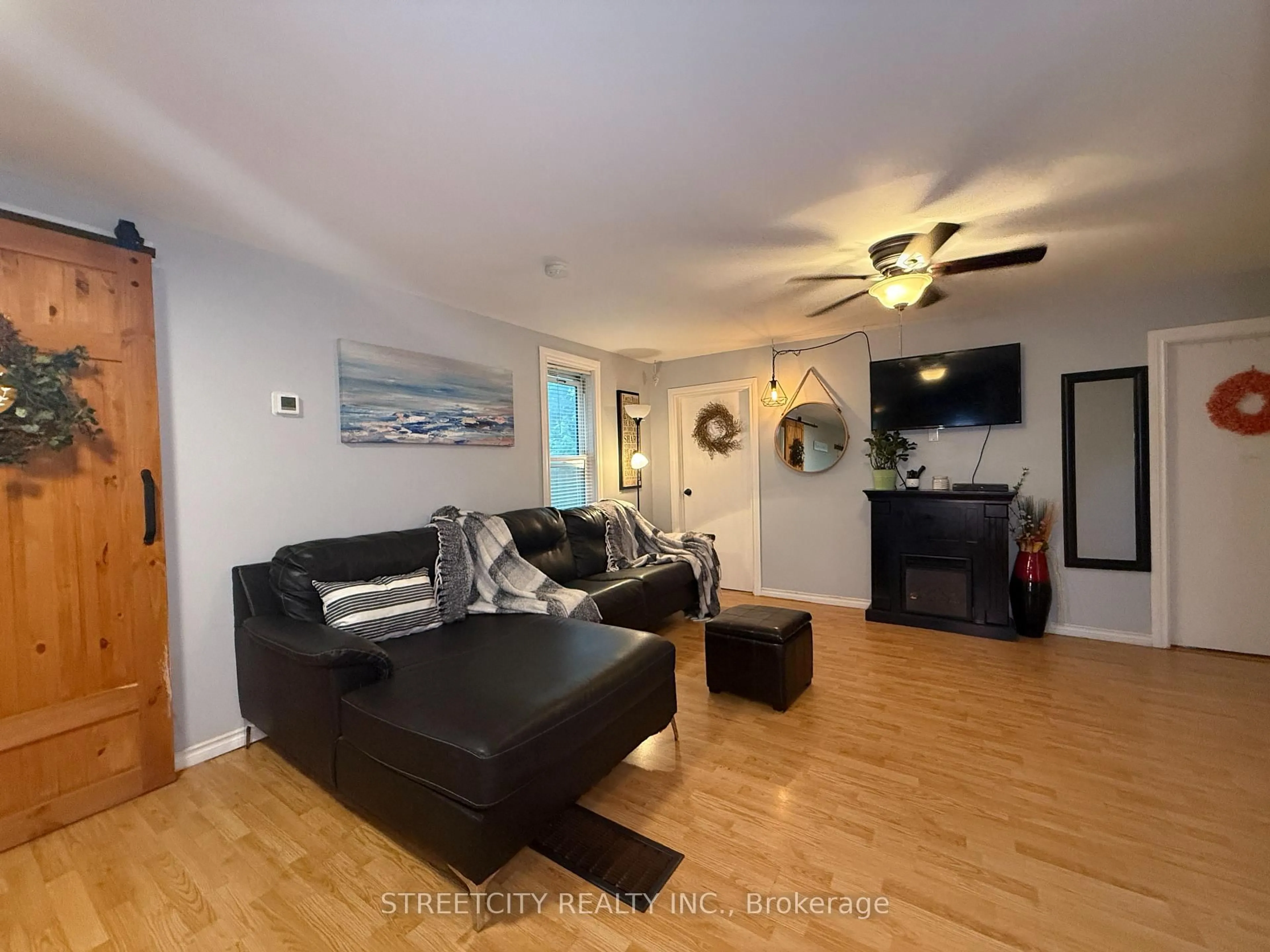 Living room with furniture, wood/laminate floor for 4361 fifth St, Petrolia Ontario N0N 1R0