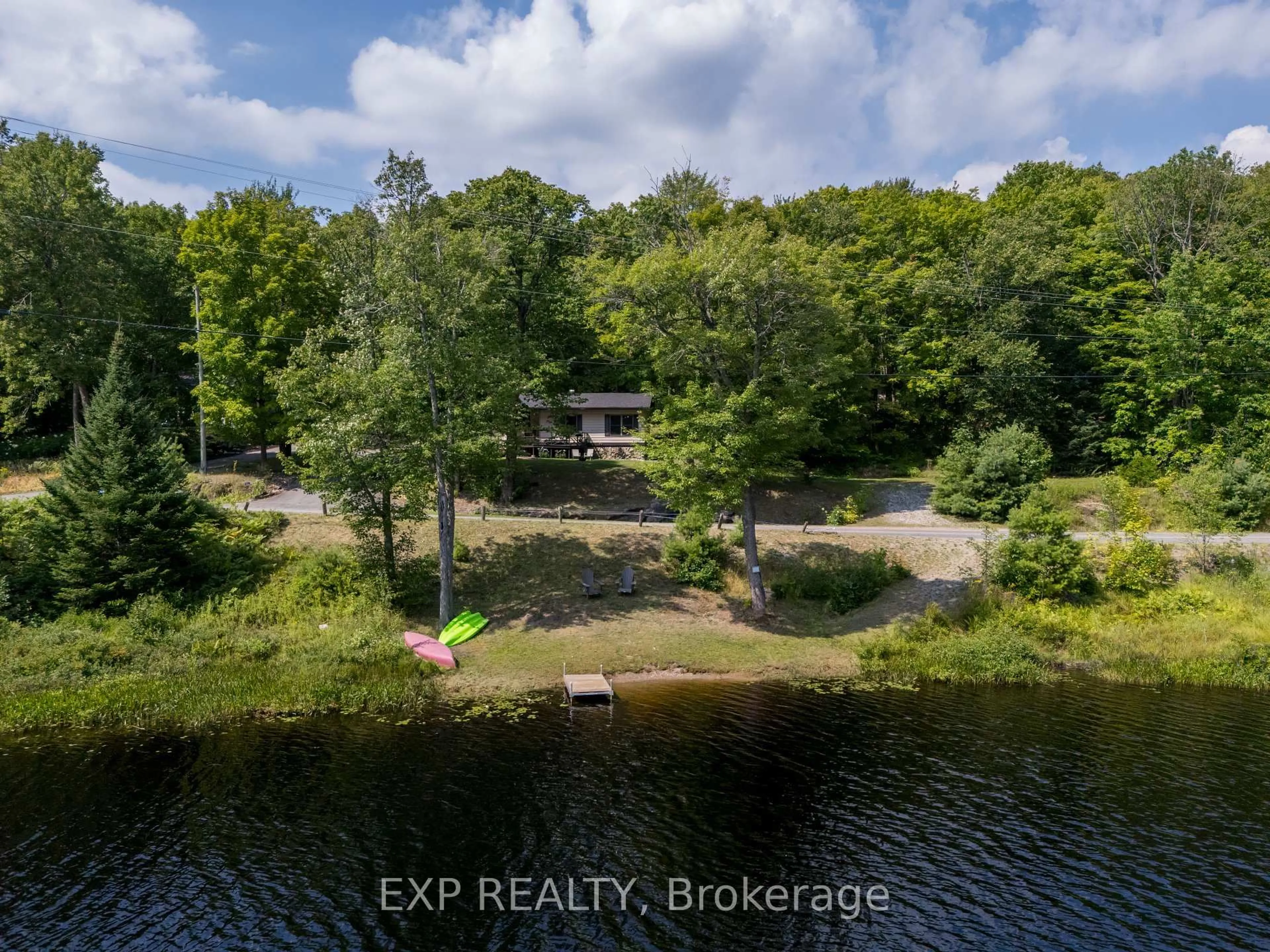 A pic from outside/outdoor area/front of a property/back of a property/a pic from drone, water/lake/river/ocean view for 1867 Fraserburg Rd, Bracebridge Ontario P1L 1X3