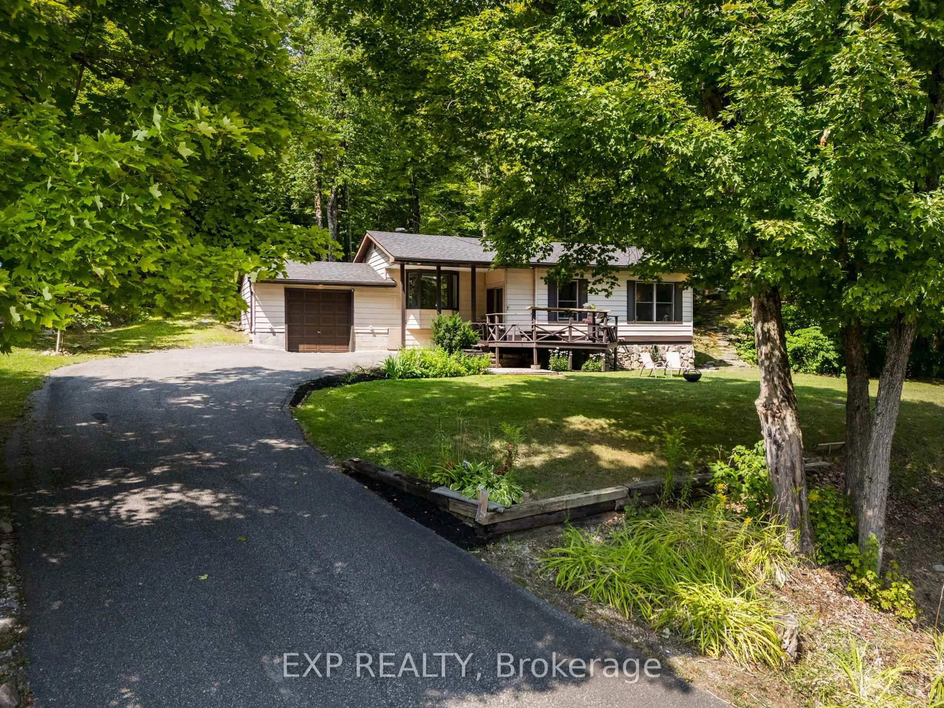 A pic from outside/outdoor area/front of a property/back of a property/a pic from drone, water/lake/river/ocean view for 1867 Fraserburg Rd, Bracebridge Ontario P1L 1X3
