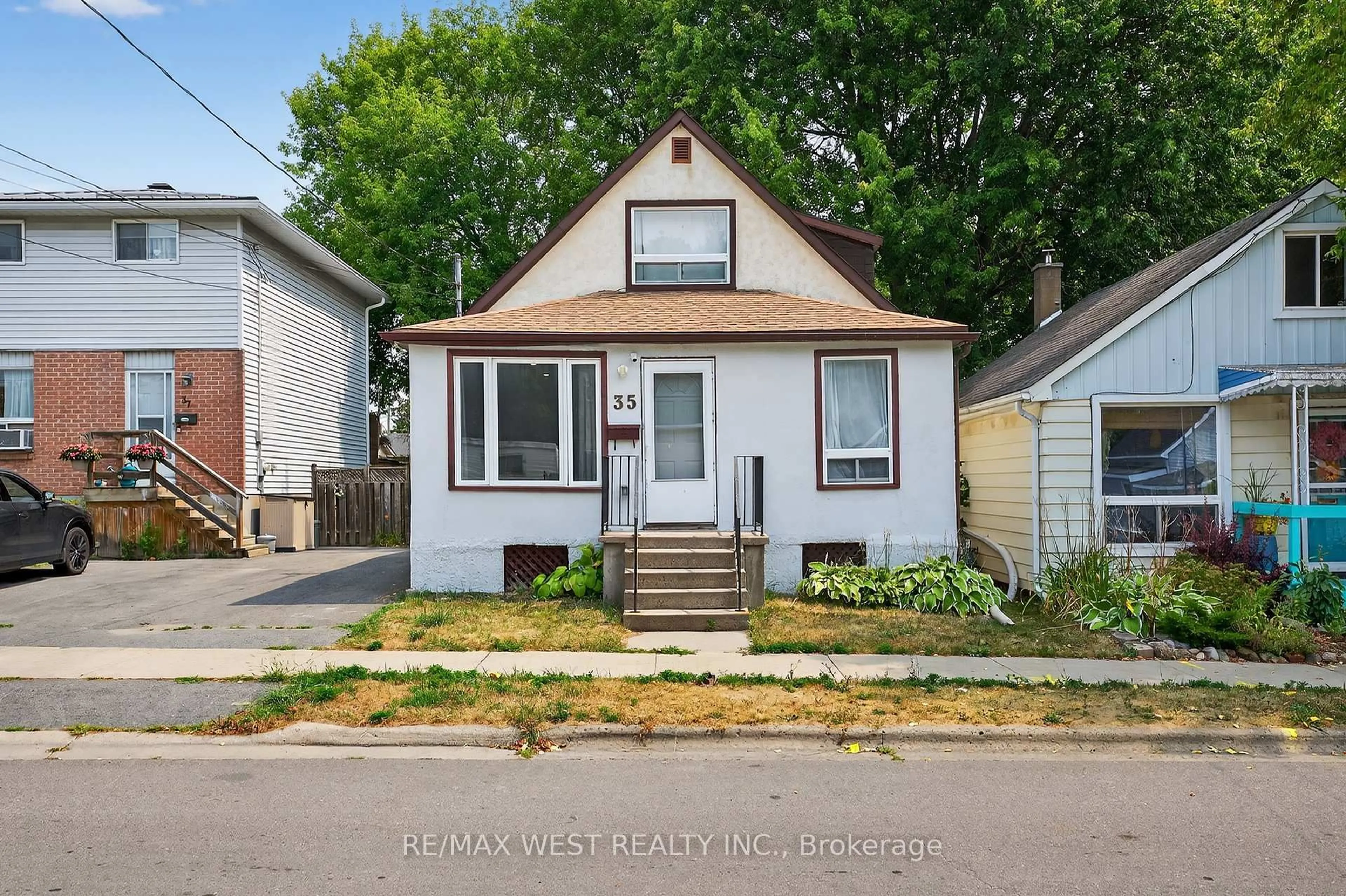 Home with vinyl exterior material, street for 35 Kingscourt Ave, Kingston Ontario K7K 4N6