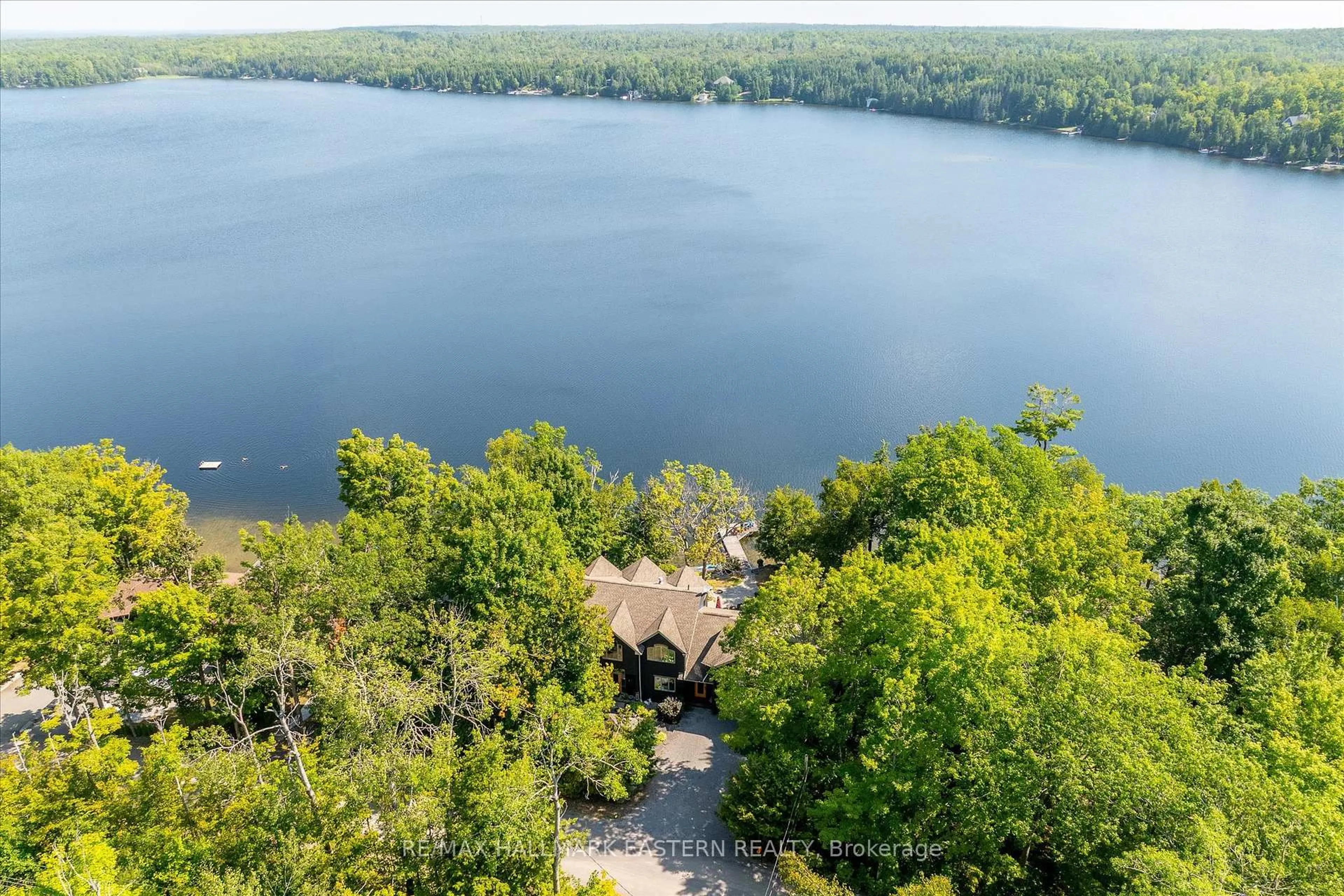 A pic from outside/outdoor area/front of a property/back of a property/a pic from drone, water/lake/river/ocean view for 1855 White Lake Rd, Douro-Dummer Ontario K0L 2H0