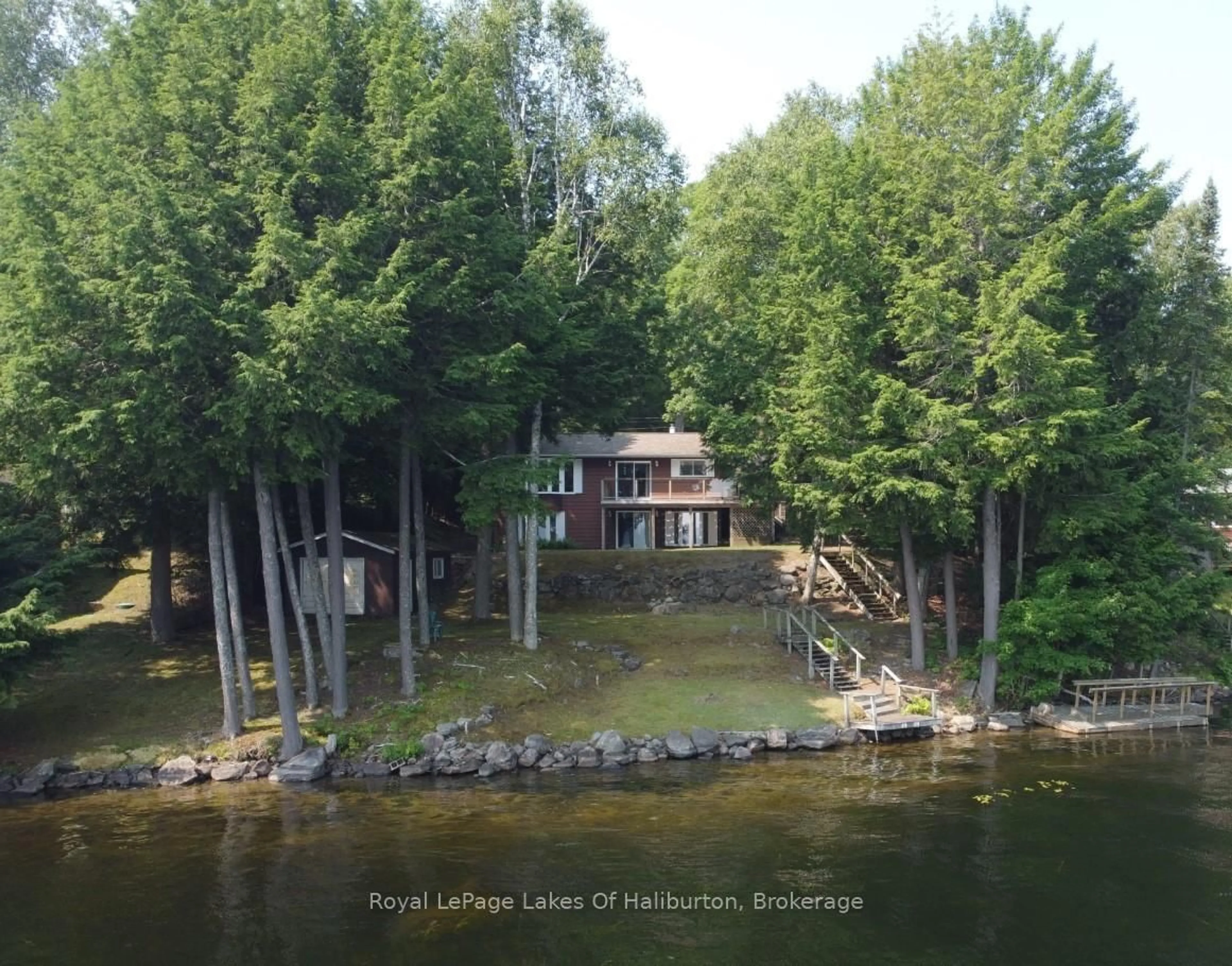 A pic from outside/outdoor area/front of a property/back of a property/a pic from drone, water/lake/river/ocean view for 1051 Autumn Lane, Dysart et al Ontario K0M 1S0
