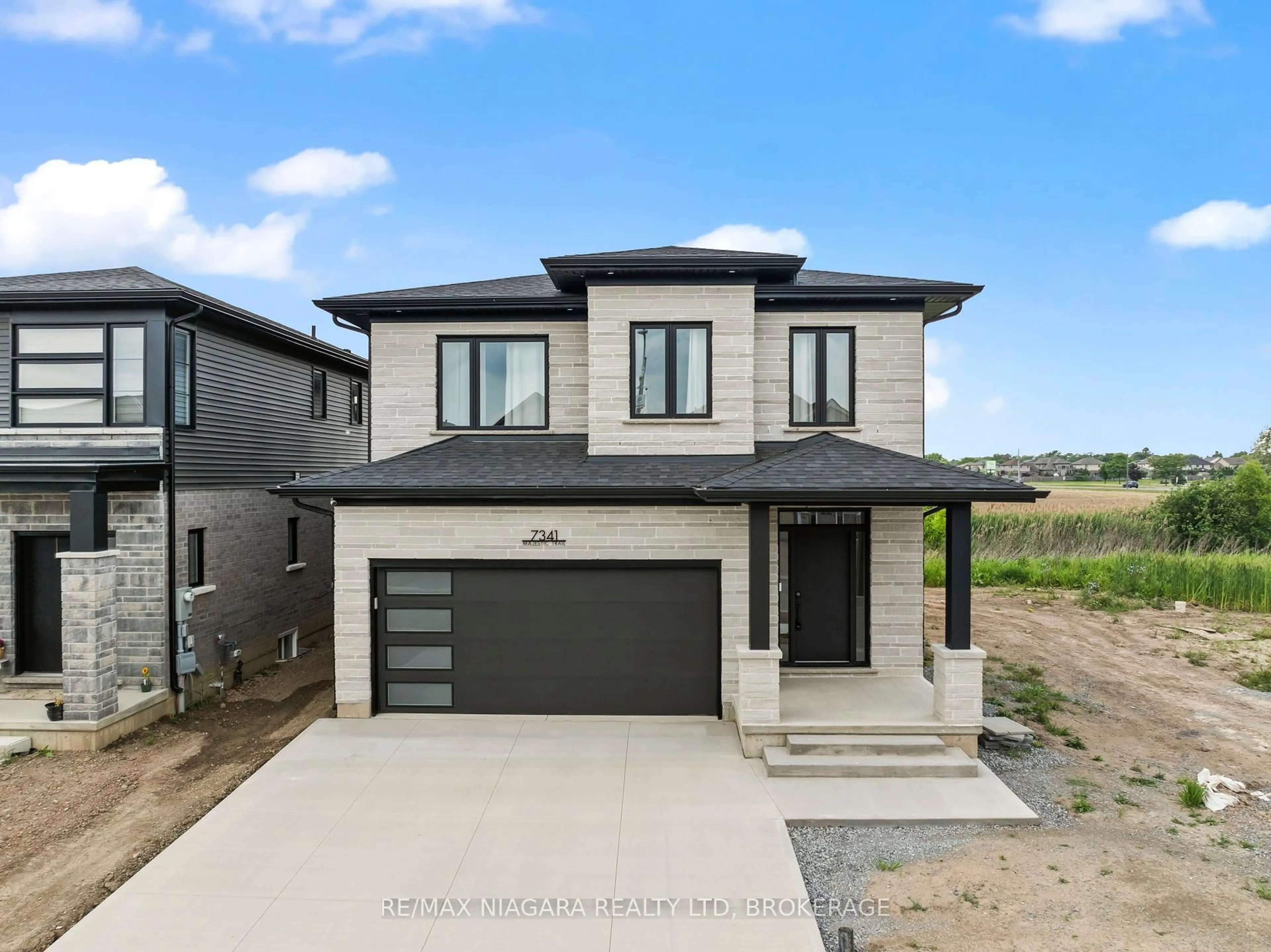 Home with brick exterior material, street for 7341 Majestic Tr, Niagara Falls Ontario L2H 0K7