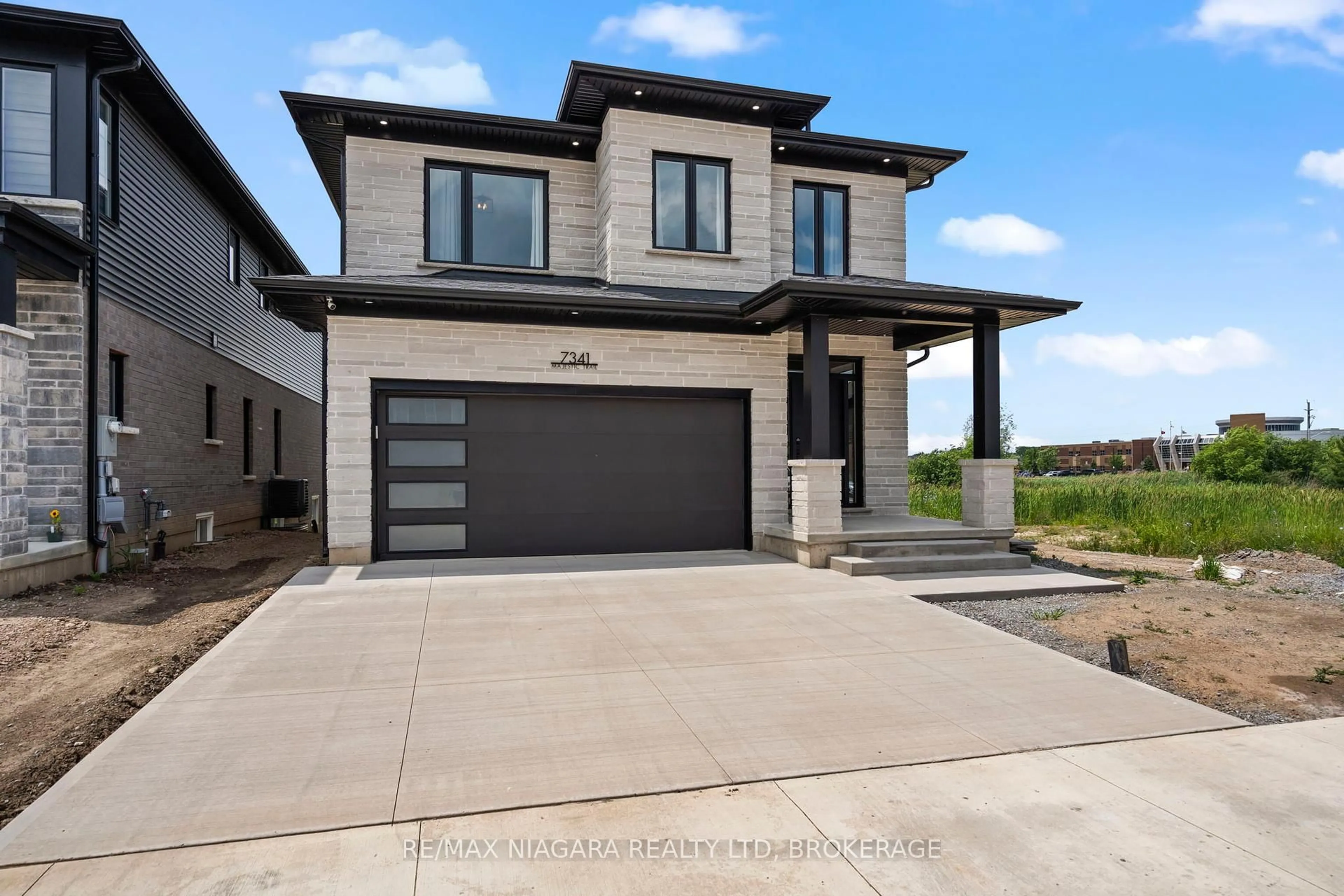 Home with brick exterior material, street for 7341 Majestic Tr, Niagara Falls Ontario L2H 0K7