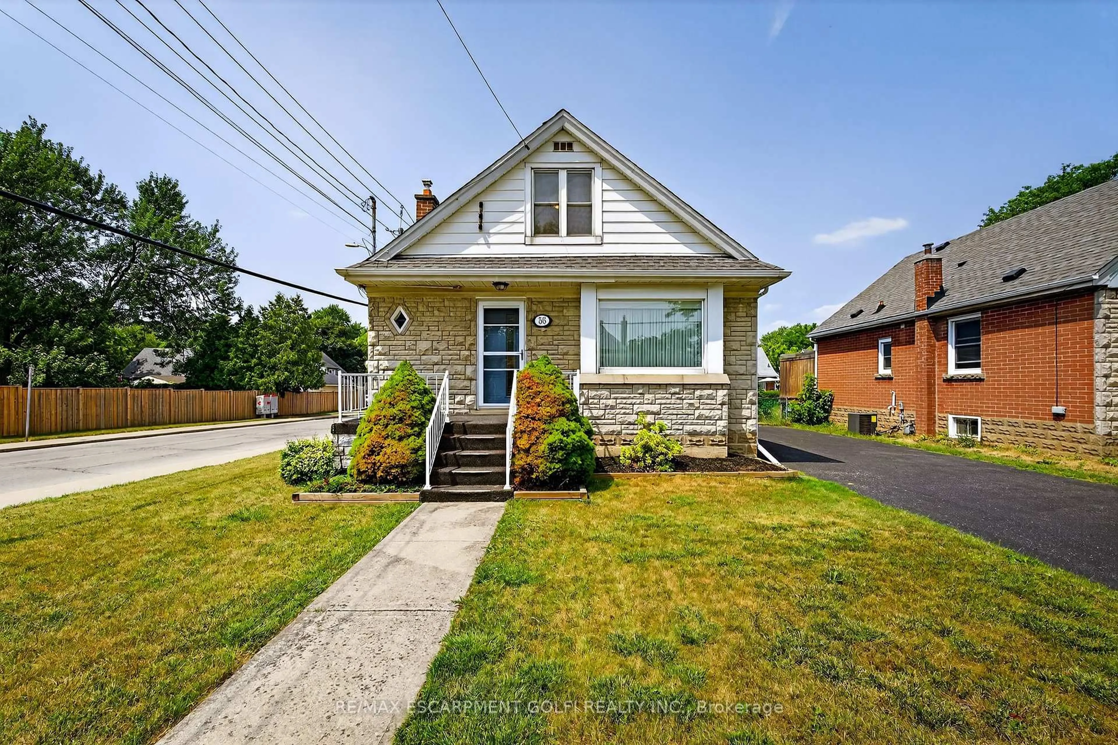 Home with brick exterior material, street for 56 West 1st St, Hamilton Ontario L9C 3C1