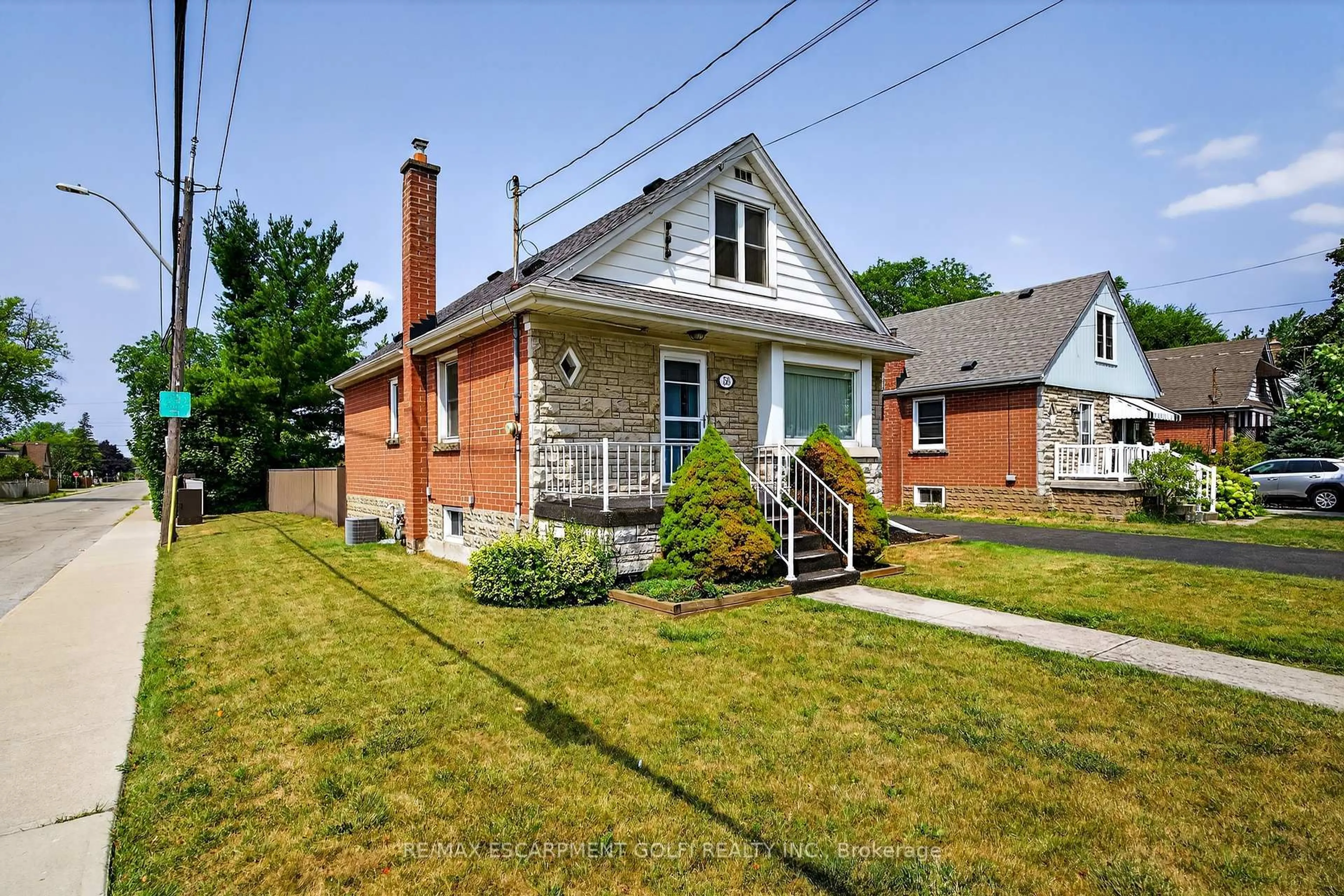 Home with brick exterior material, street for 56 West 1st St, Hamilton Ontario L9C 3C1