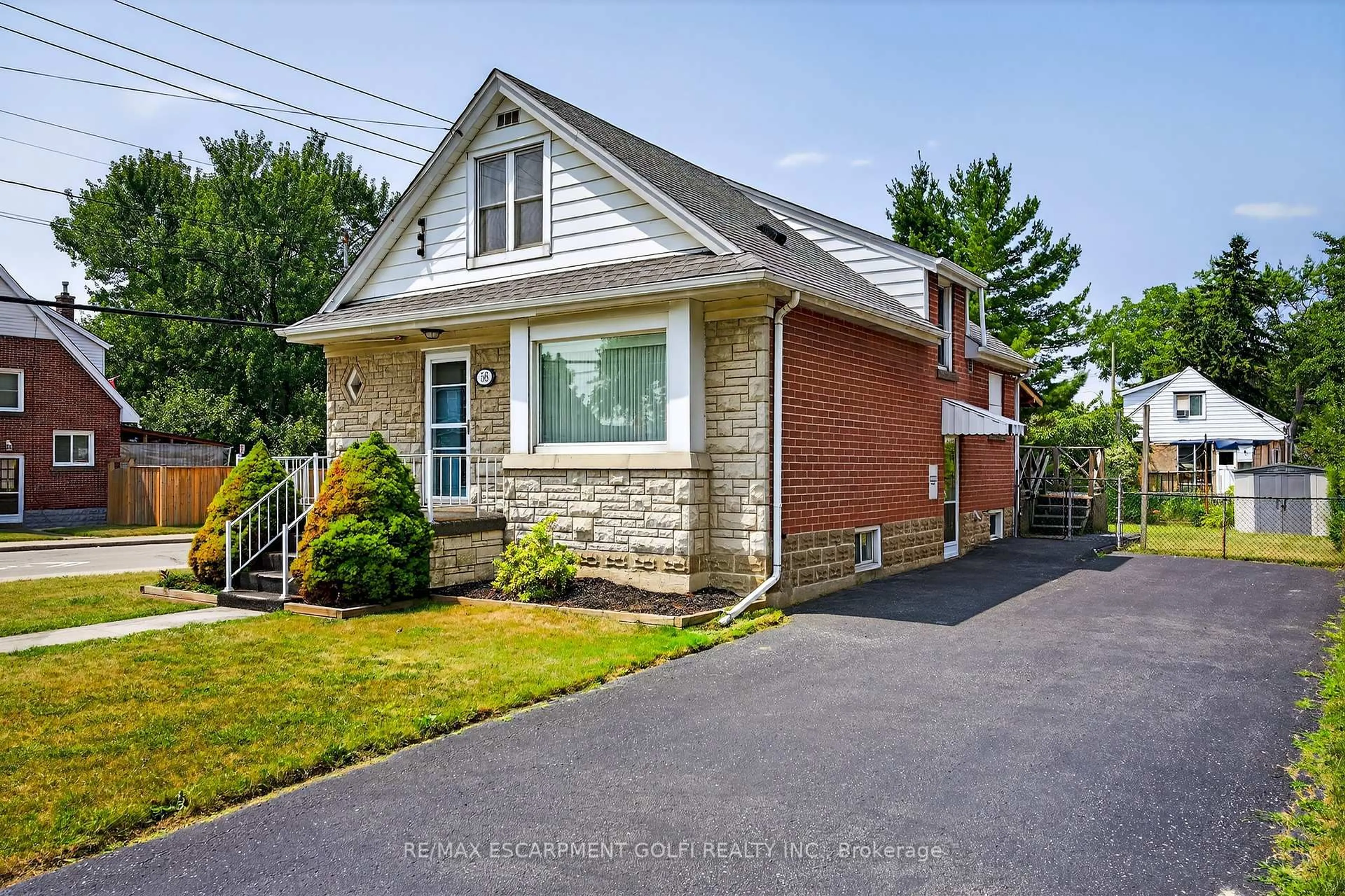 Home with brick exterior material, street for 56 West 1st St, Hamilton Ontario L9C 3C1