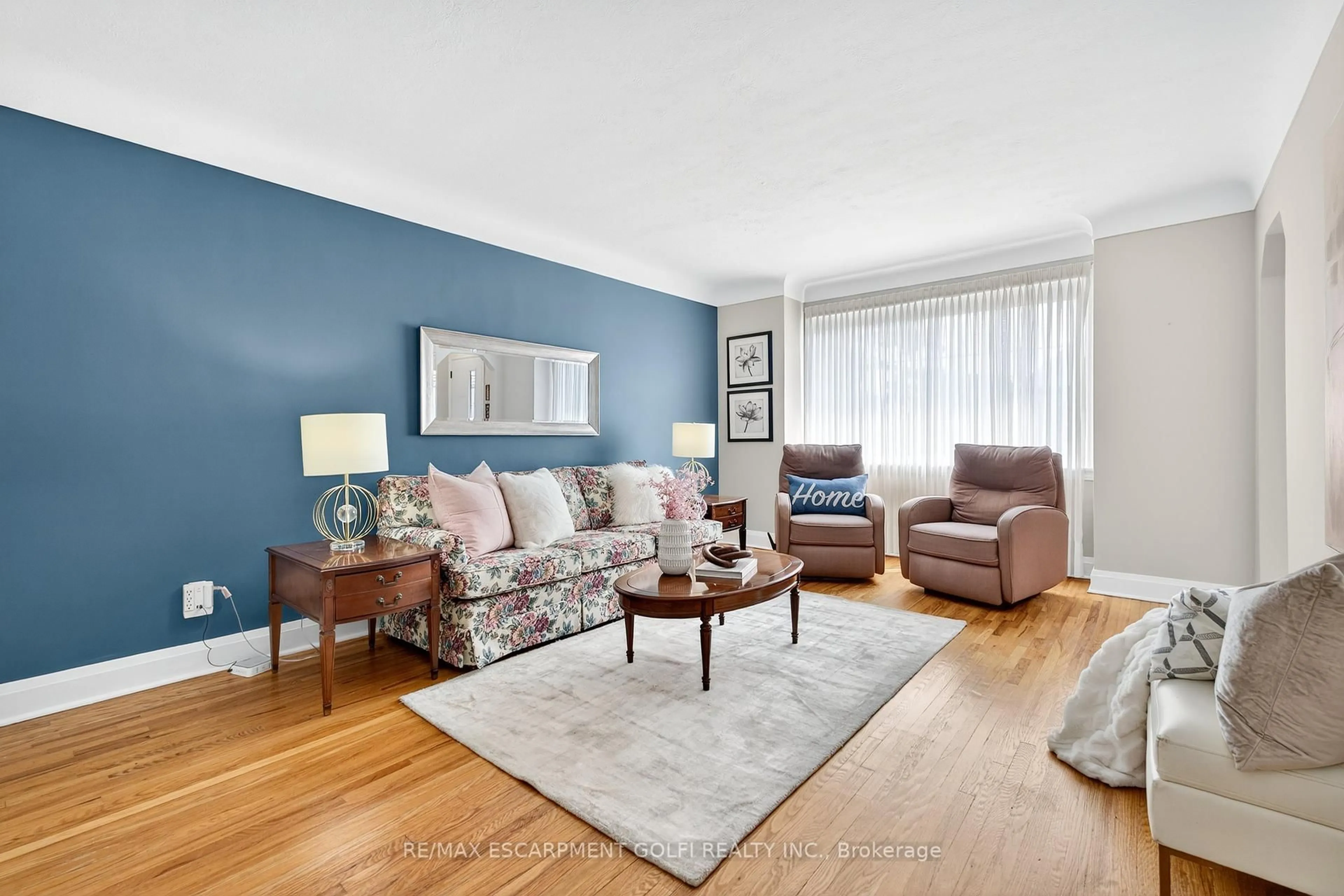 Living room with furniture, wood/laminate floor for 56 West 1st St, Hamilton Ontario L9C 3C1