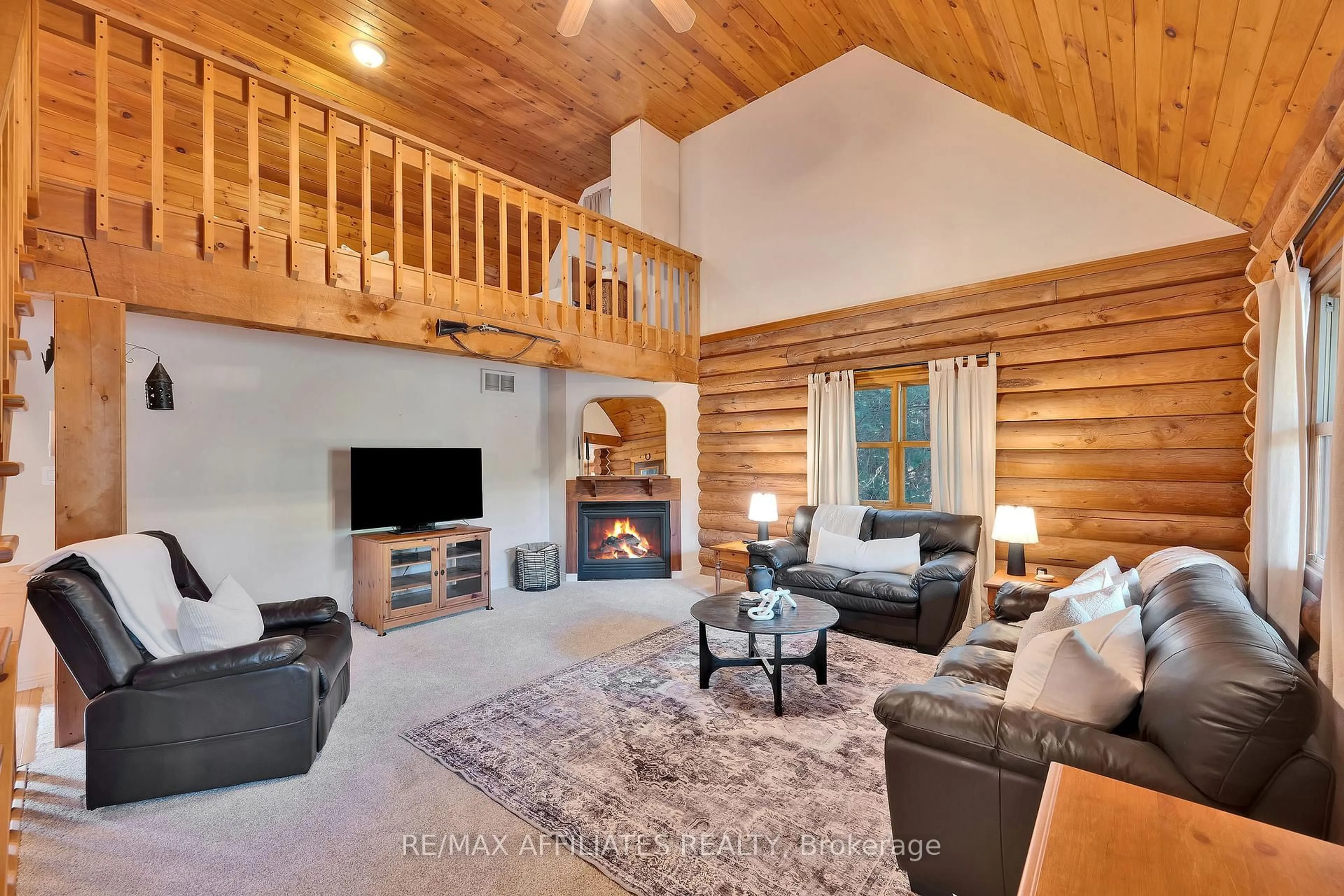 Living room with furniture, wood/laminate floor for 256 Saunders Rd, Ashton Ontario K0A 1B0