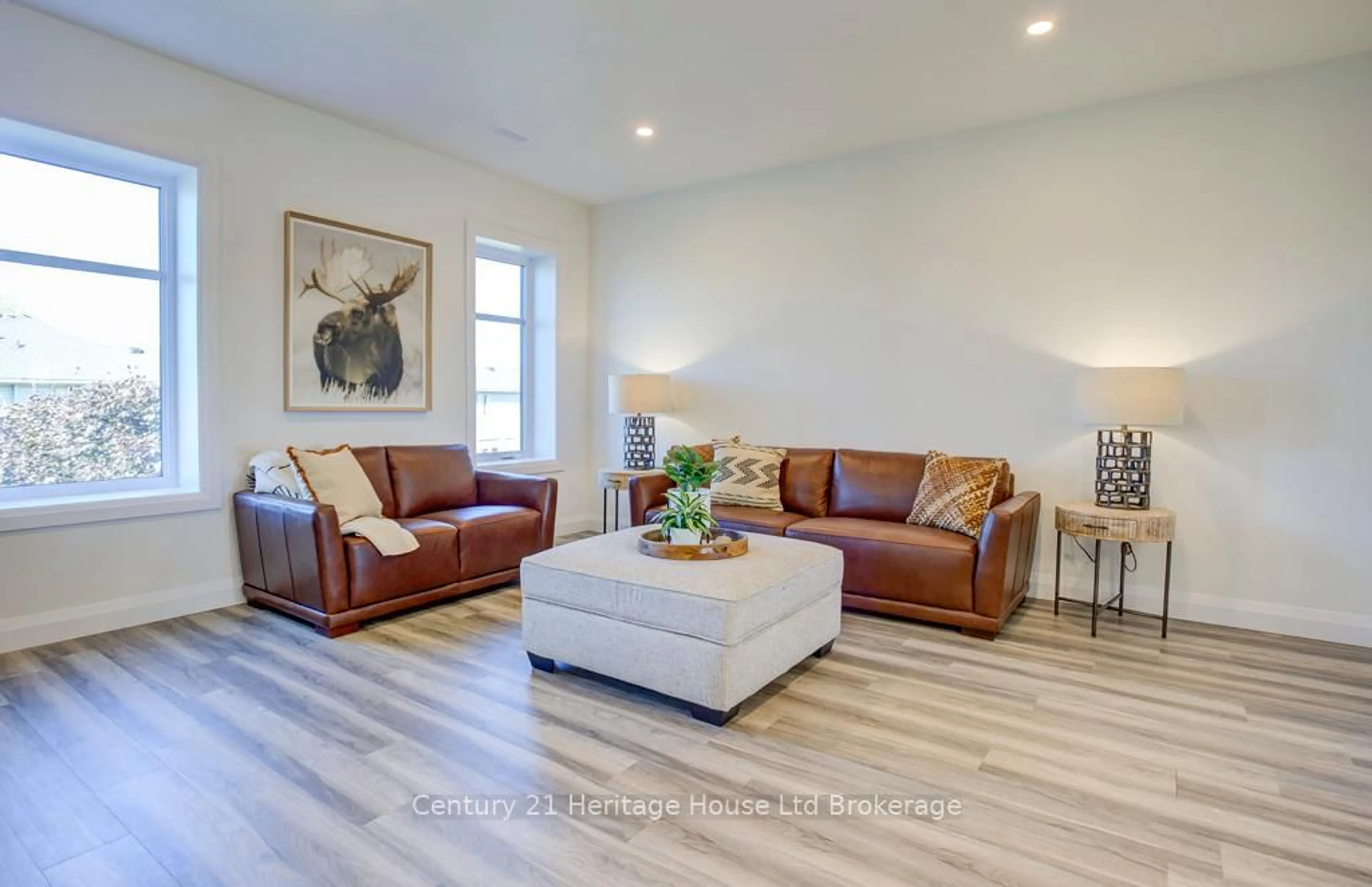 Living room with furniture, wood/laminate floor for 361 QUARTER TOWN Line #1108, Tillsonburg Ontario N4G 5T9