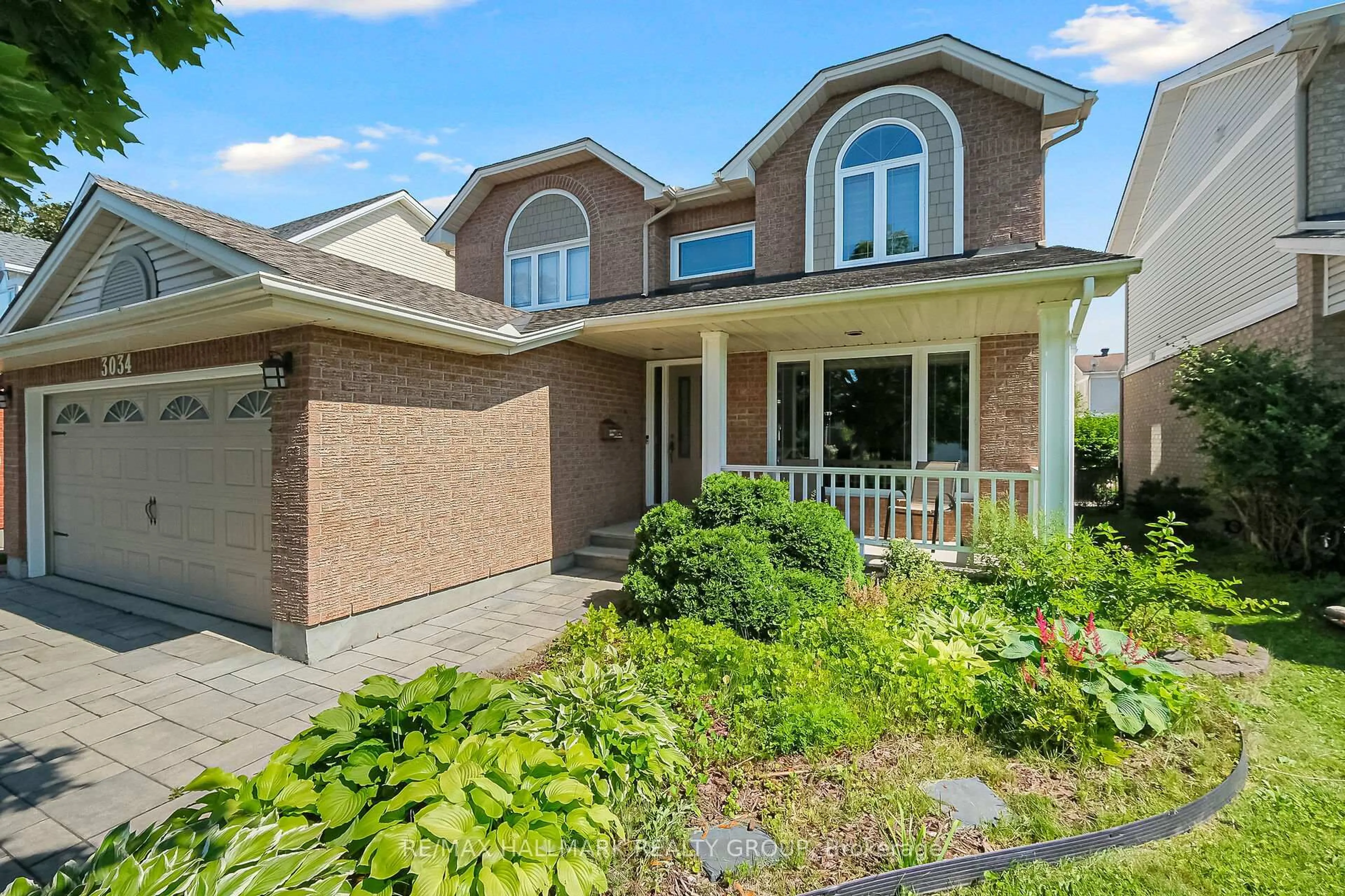 Home with brick exterior material, street for 3034 Courtyard Cres, Ottawa Ontario K1T 3R7