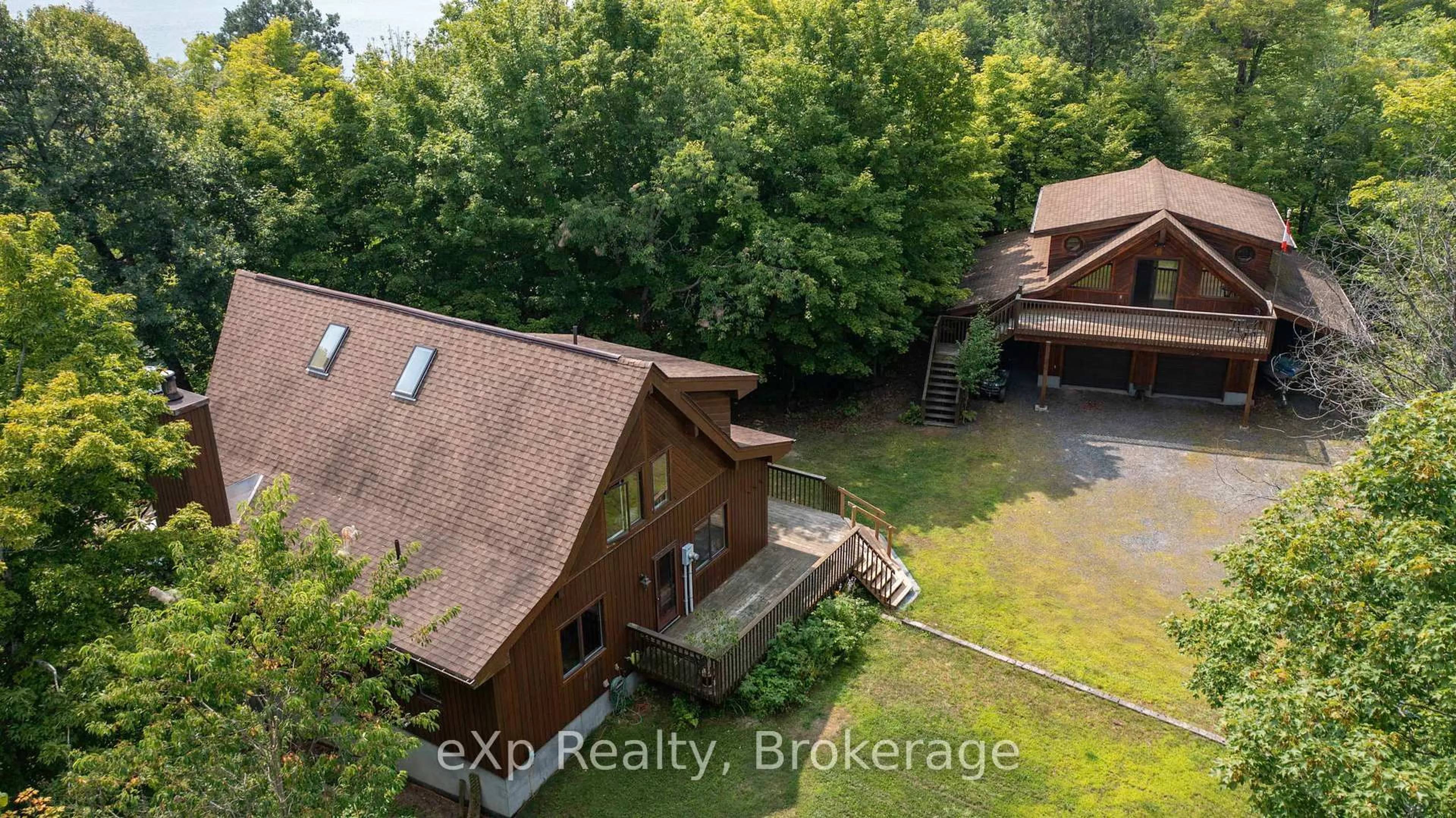 A pic from outside/outdoor area/front of a property/back of a property/a pic from drone, unknown for 23 Lizzies Lane, McKellar Ontario P2A 0B4