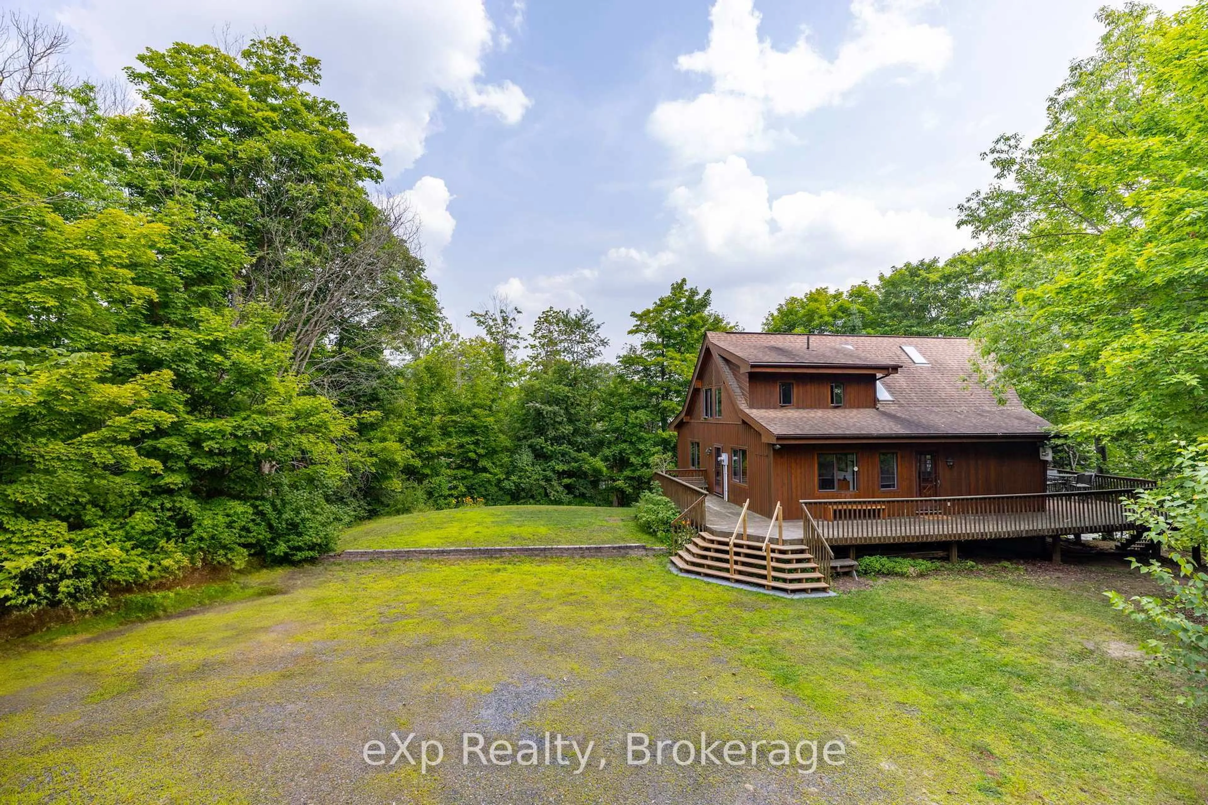 A pic from outside/outdoor area/front of a property/back of a property/a pic from drone, water/lake/river/ocean view for 23 Lizzies Lane, McKellar Ontario P2A 0B4