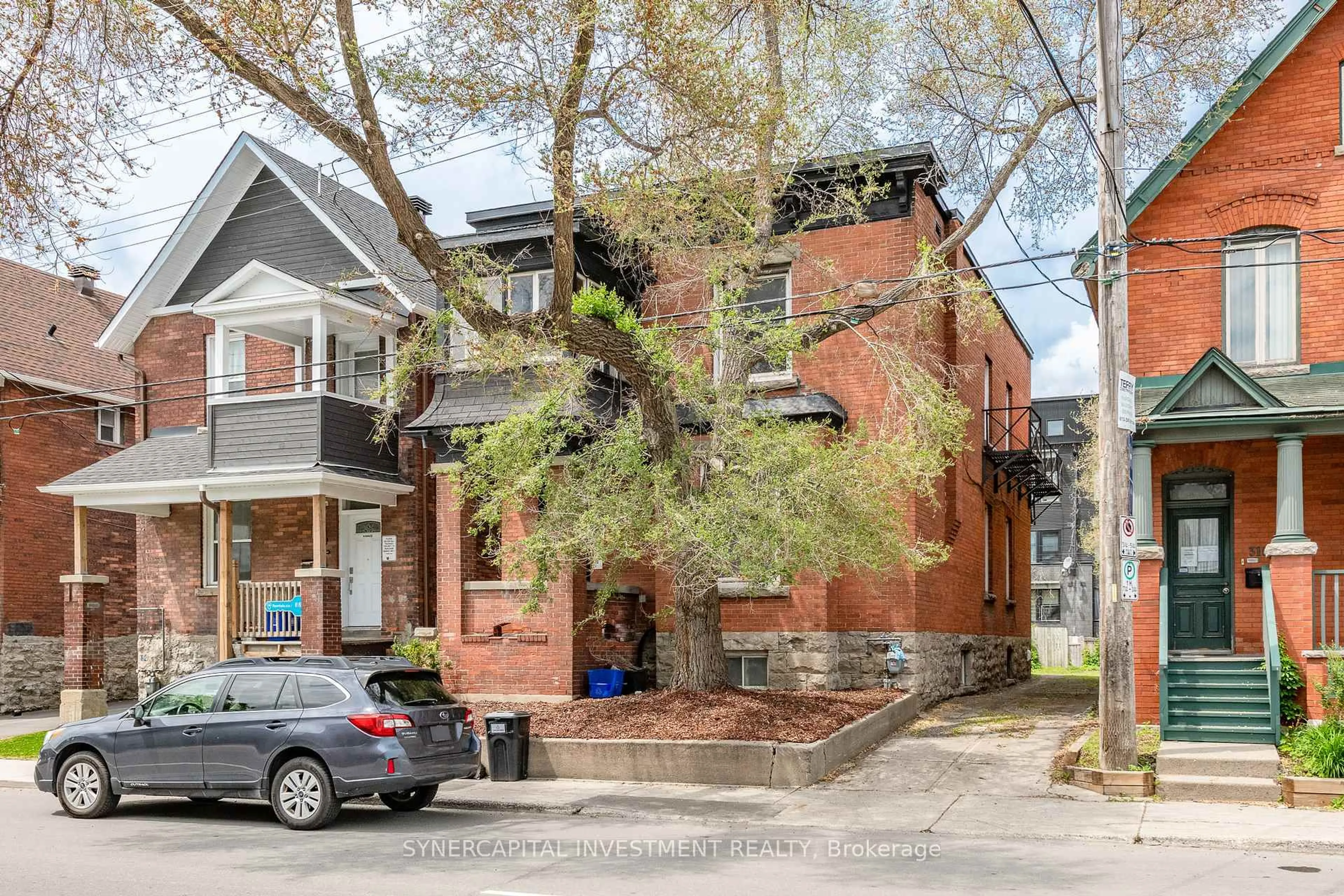 Home with brick exterior material, street for 323 Catherine St, Ottawa Ontario K1R 5T4