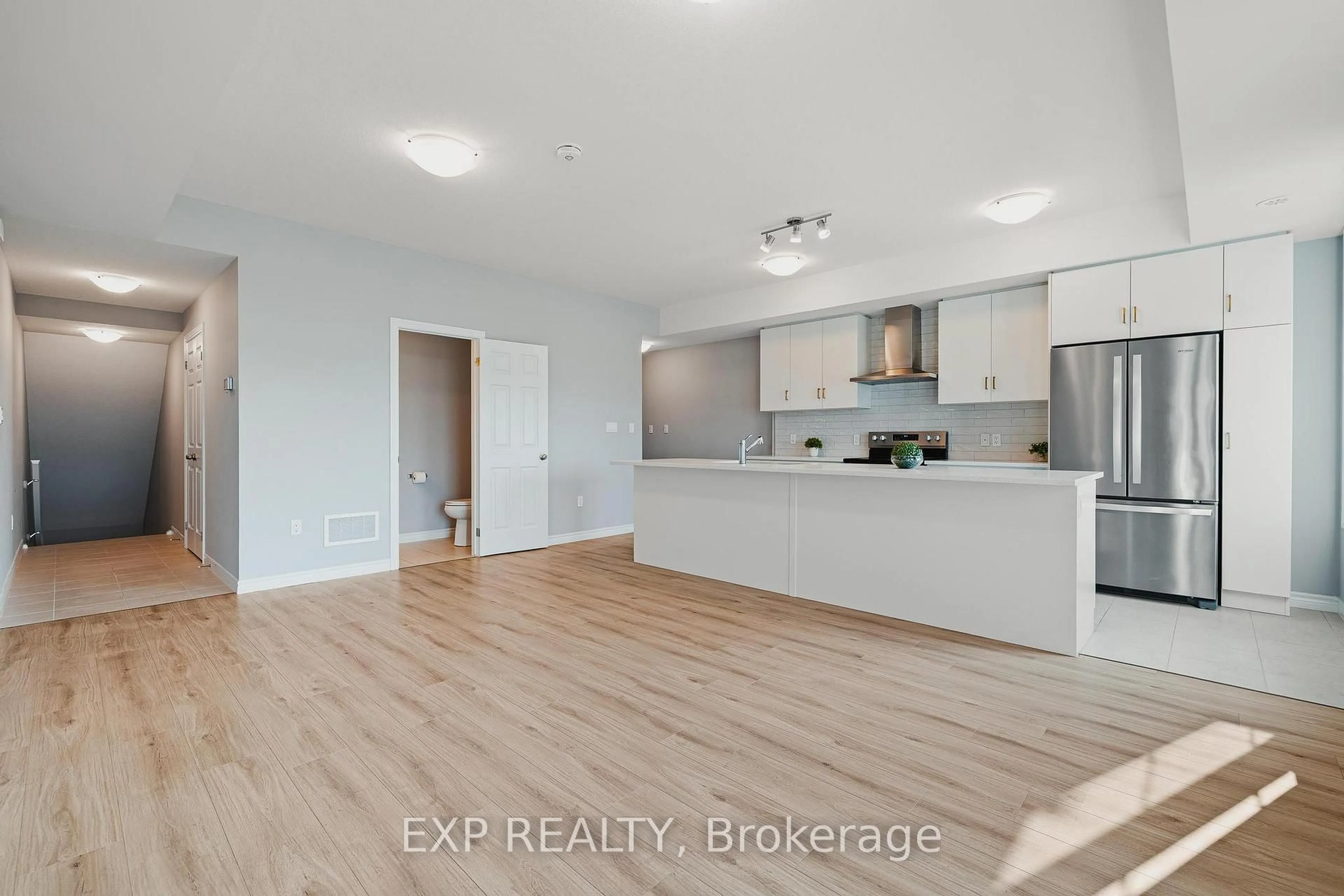 Open concept kitchen, wood/laminate floor for 104 Lomond Lane, Kitchener Ontario N2R 0T6