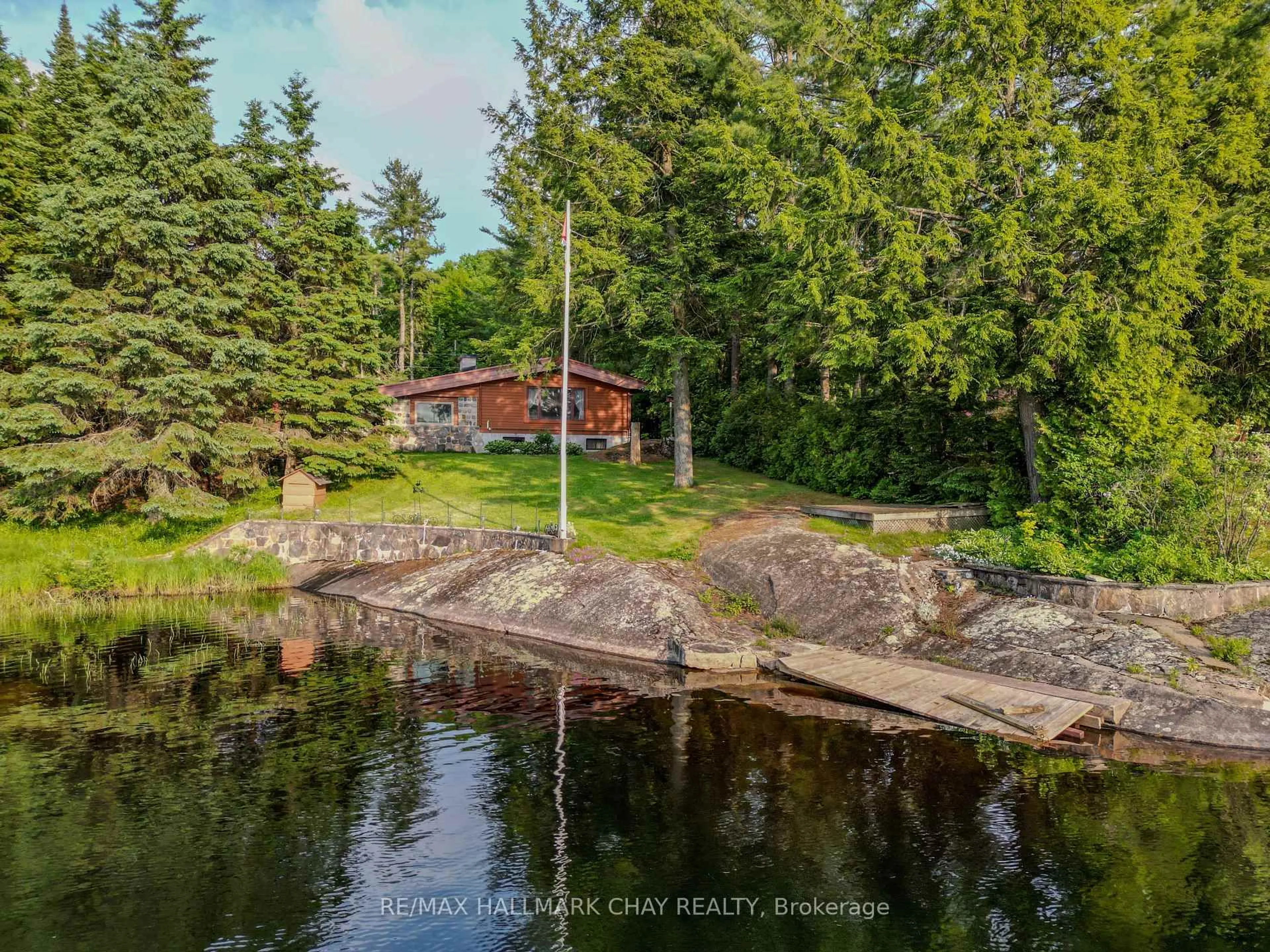 A pic from outside/outdoor area/front of a property/back of a property/a pic from drone, water/lake/river/ocean view for 1070 Chaikof Rd, Bracebridge Ontario P1P 1R3