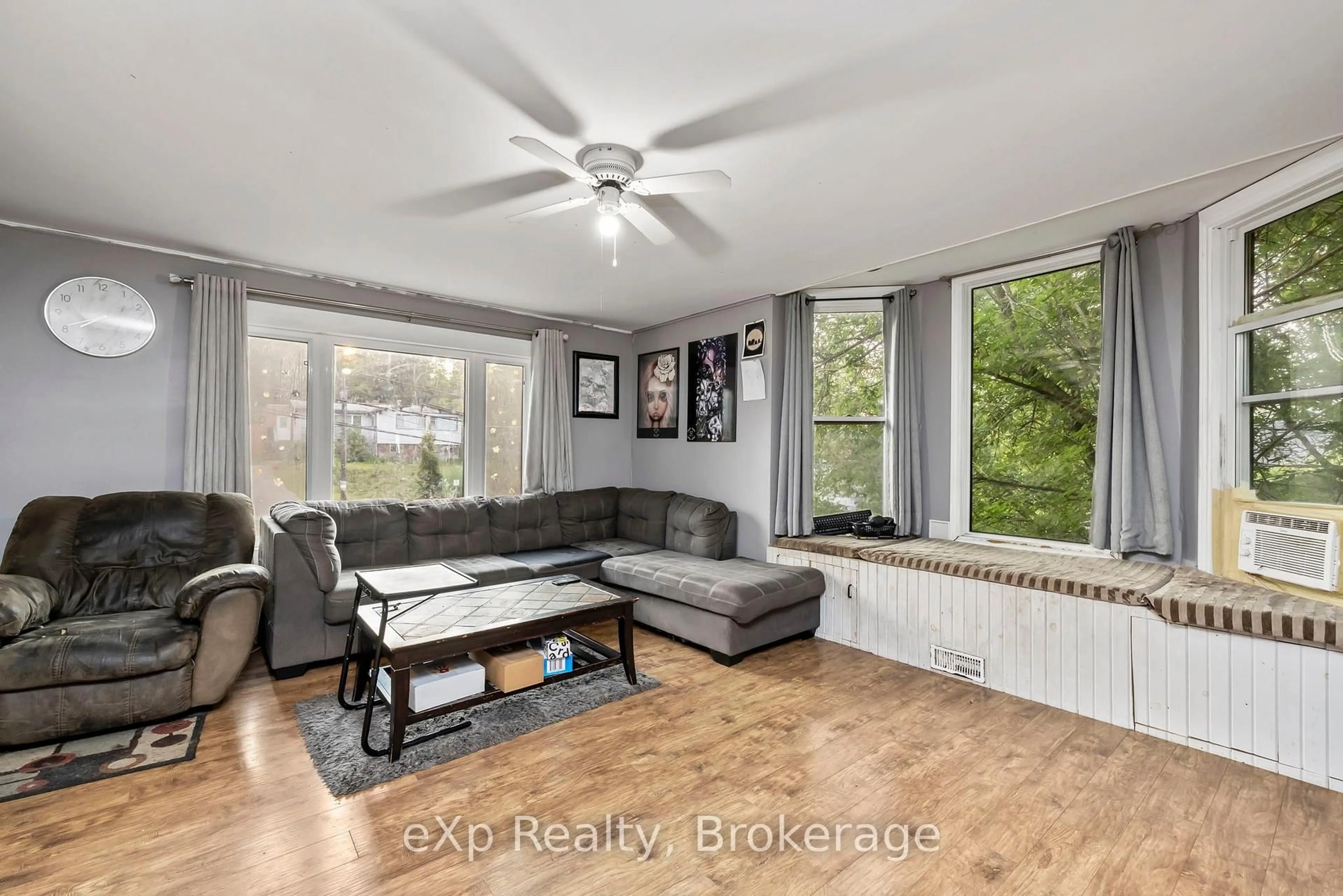 Living room with furniture, wood/laminate floor for 28 Emily St, Parry Sound Ontario P2A 2P5