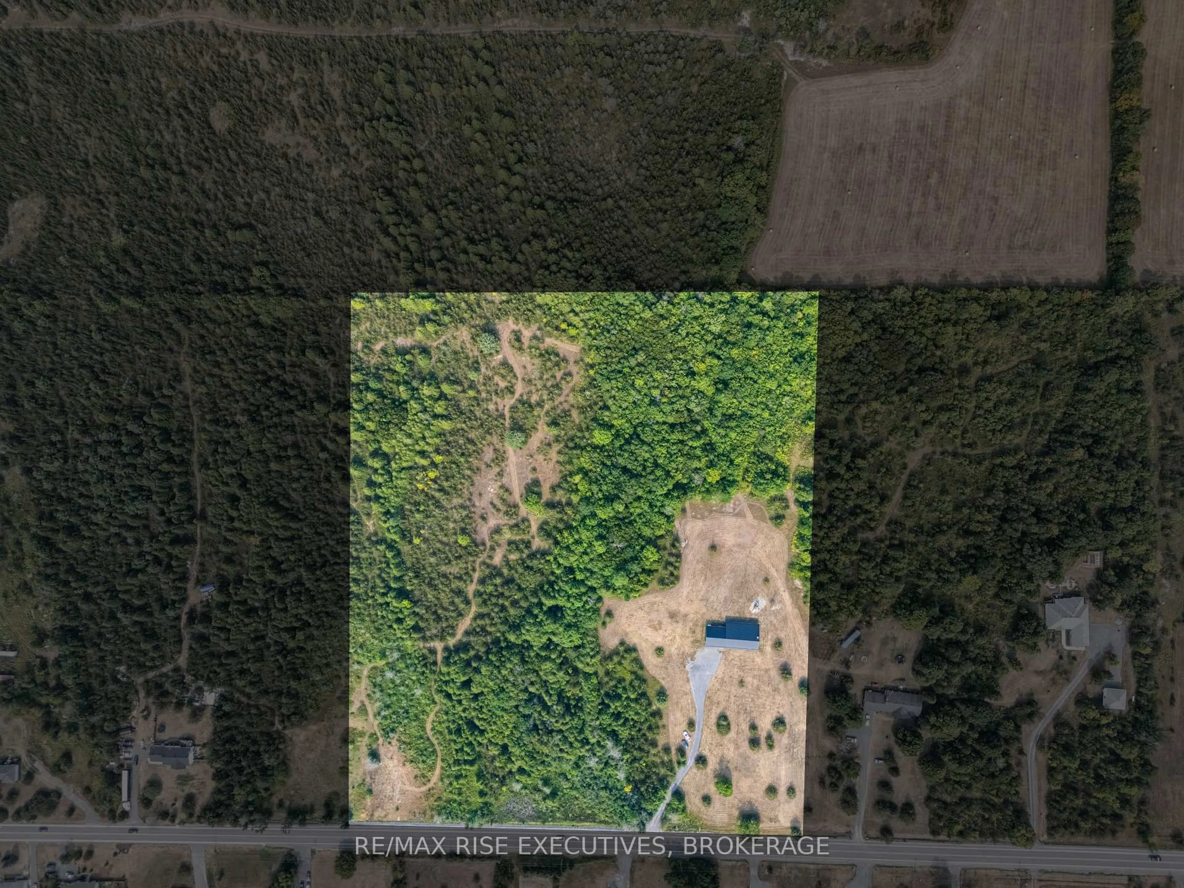 A pic from outside/outdoor area/front of a property/back of a property/a pic from drone, forest/trees view for 2621 County Road 6 Rd, Yarker Ontario K0K 3N0