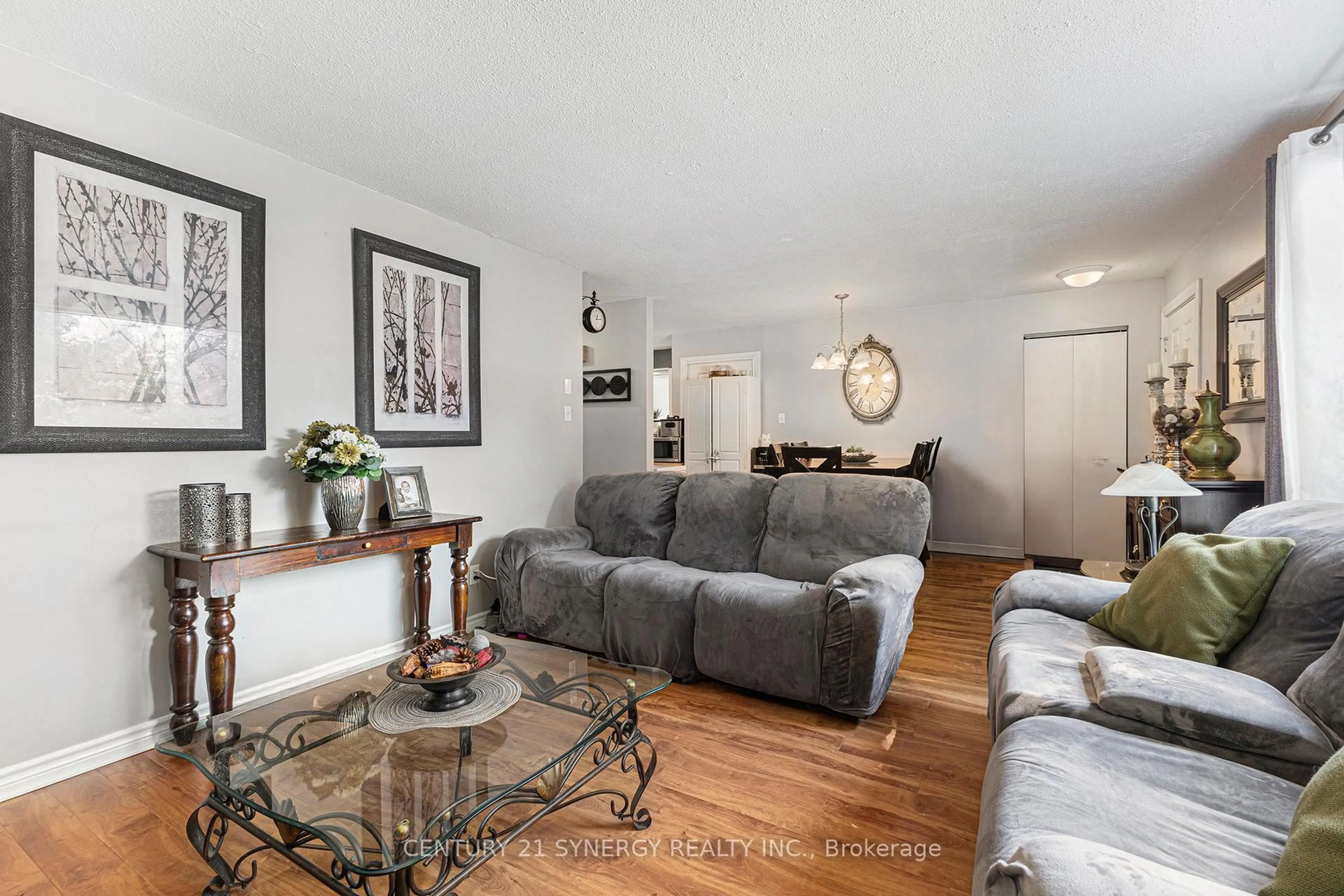 Living room with furniture, wood/laminate floor for 389 Thomas St, Carleton Place Ontario K7C 3Z3