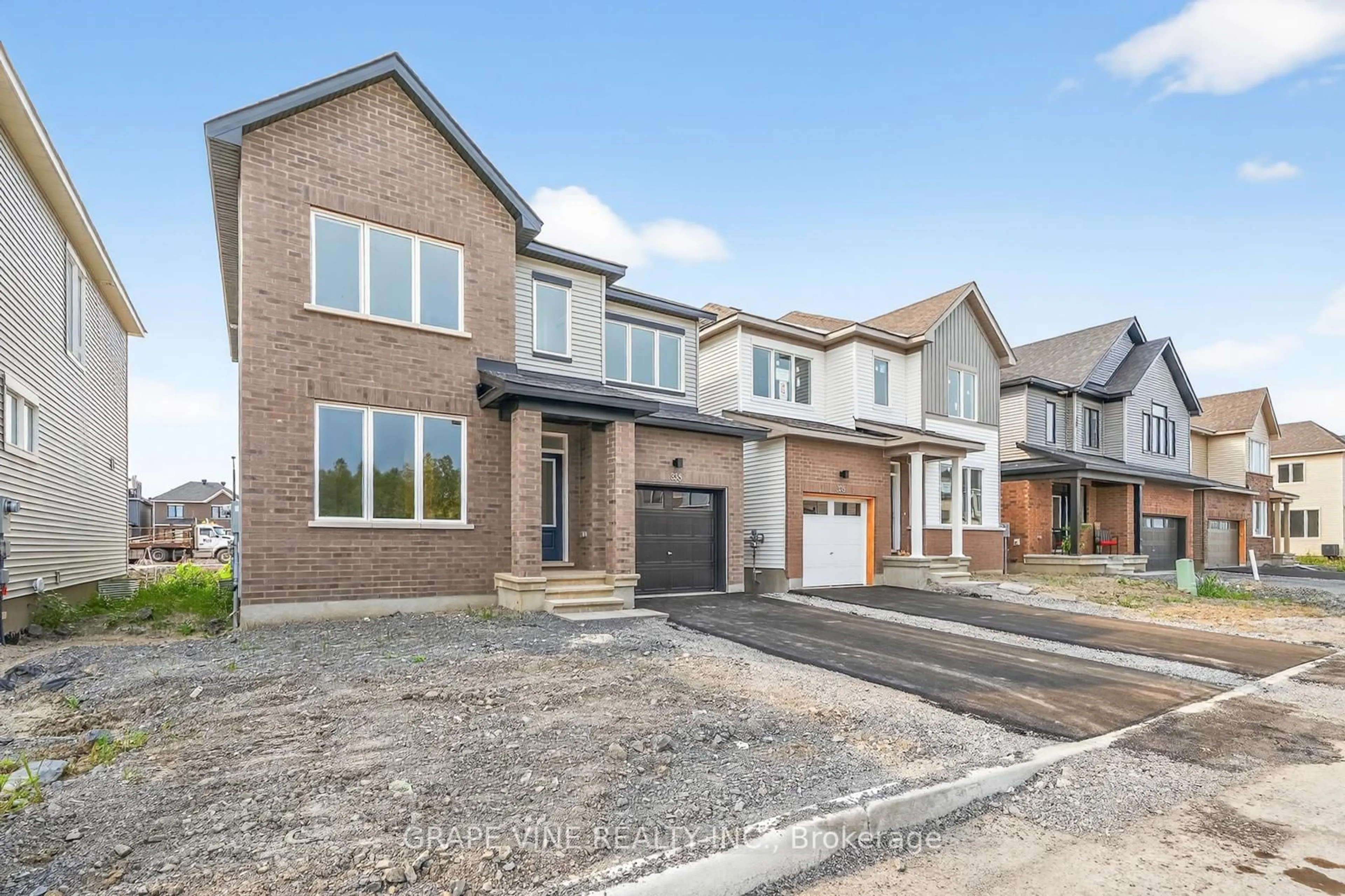 Home with brick exterior material, street for 335 Les Emmerson Dr, Ottawa Ontario K2J 0P1