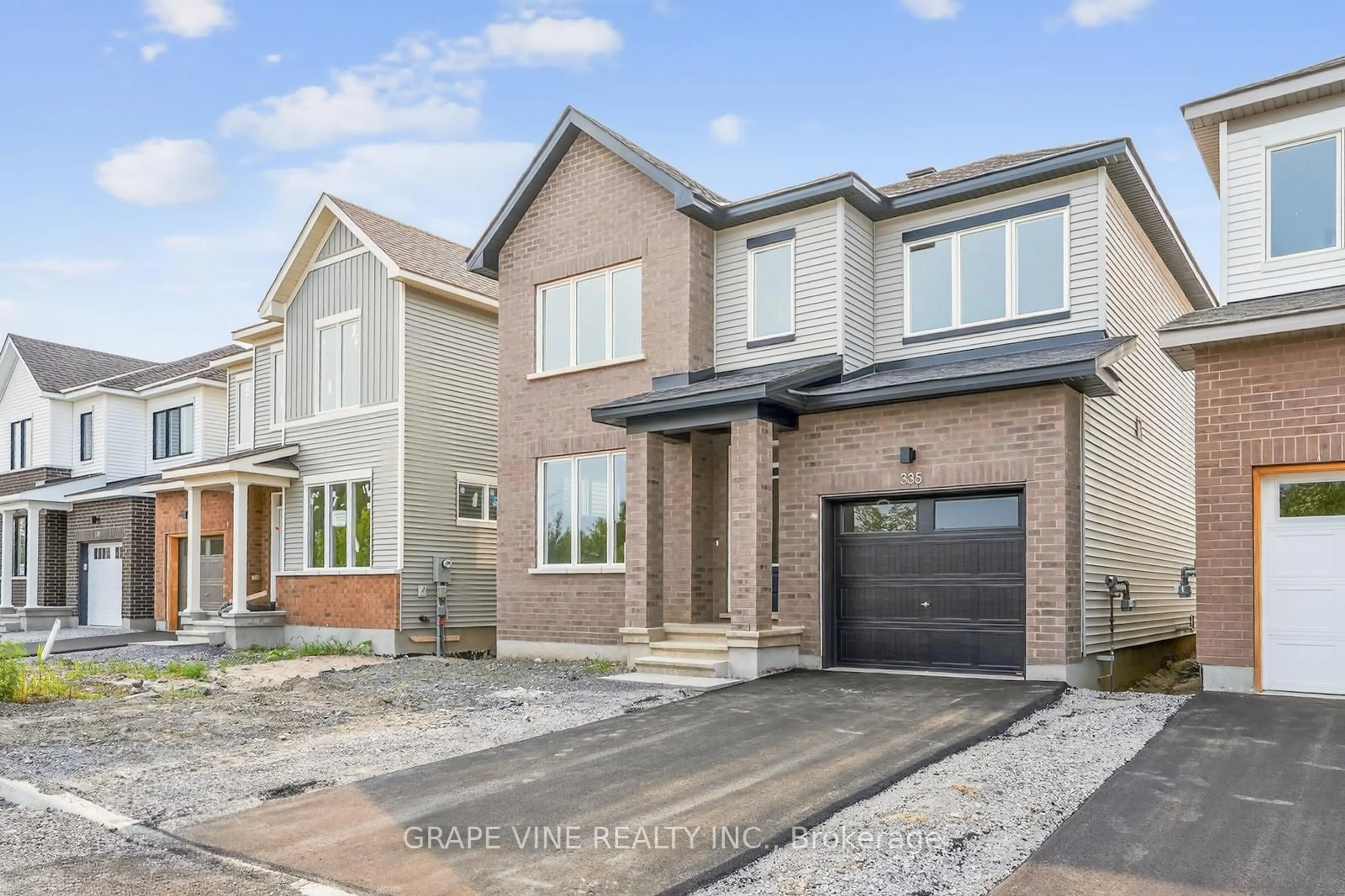 Home with brick exterior material, street for 335 Les Emmerson Dr, Ottawa Ontario K2J 0P1