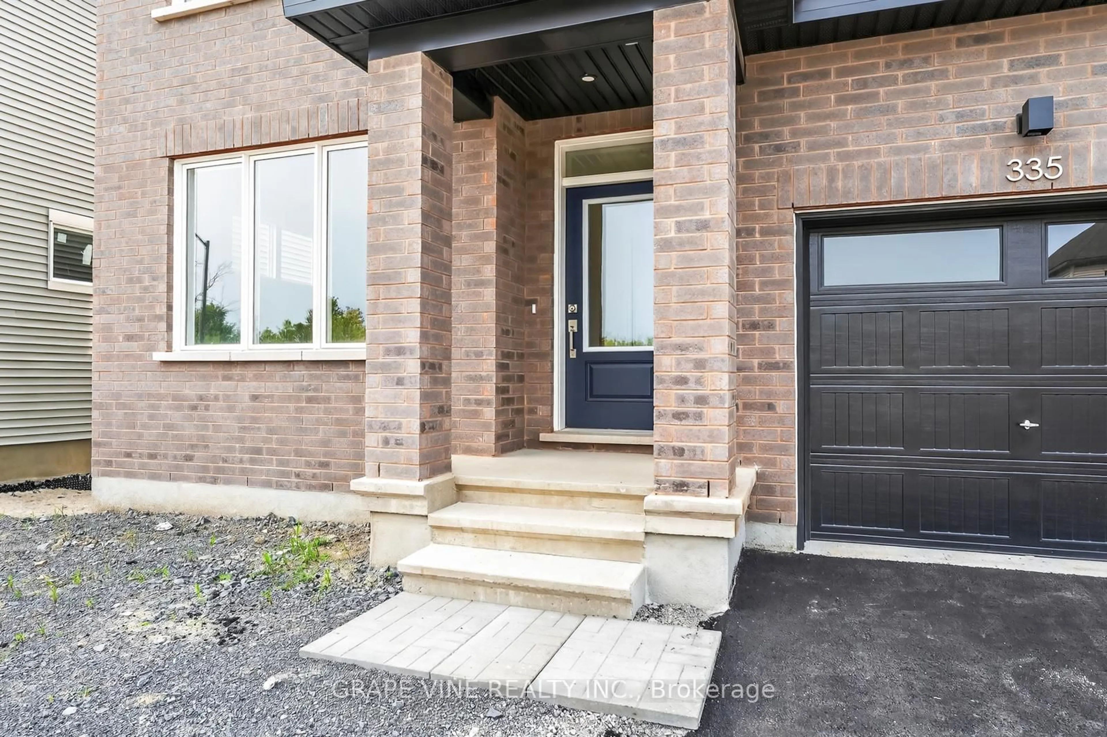 Home with brick exterior material, street for 335 Les Emmerson Dr, Ottawa Ontario K2J 0P1