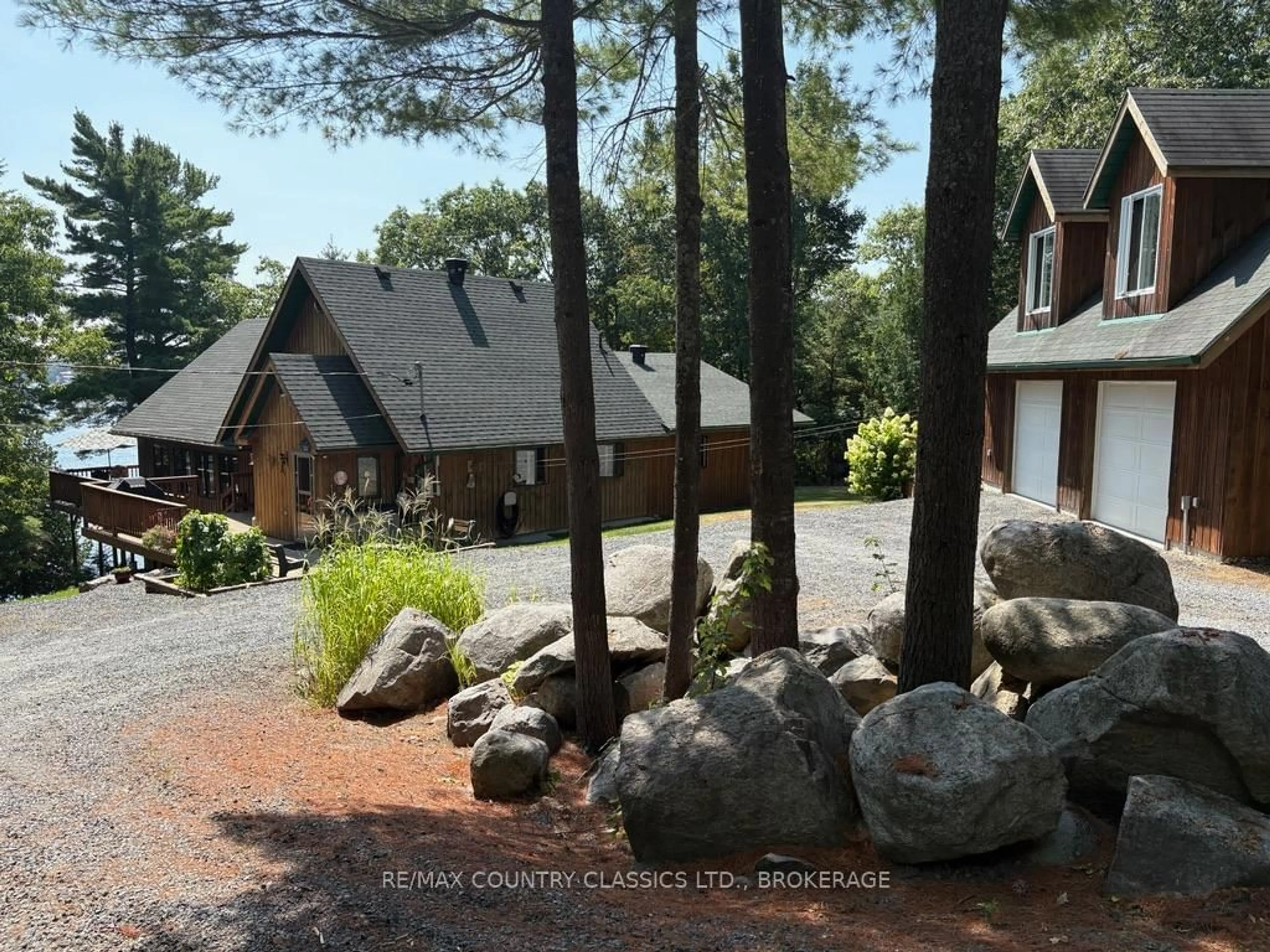 A pic from outside/outdoor area/front of a property/back of a property/a pic from drone, forest/trees view for 1200 South Pinnacle Point Lane, Arden Ontario K0H 1B0