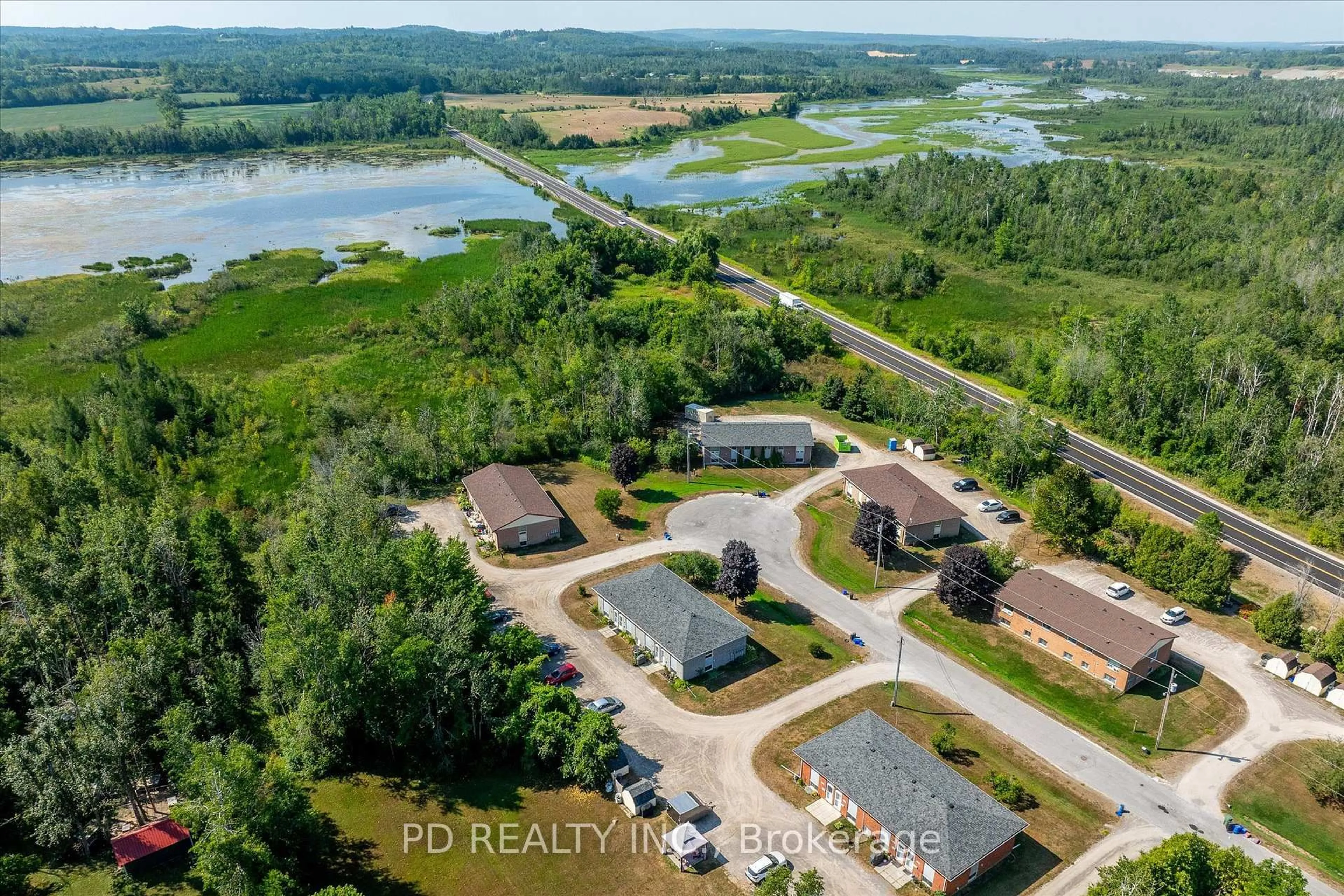 A pic from outside/outdoor area/front of a property/back of a property/a pic from drone, water/lake/river/ocean view for 102 Rita Cres #C, Kawartha Lakes Ontario K0L 2W0