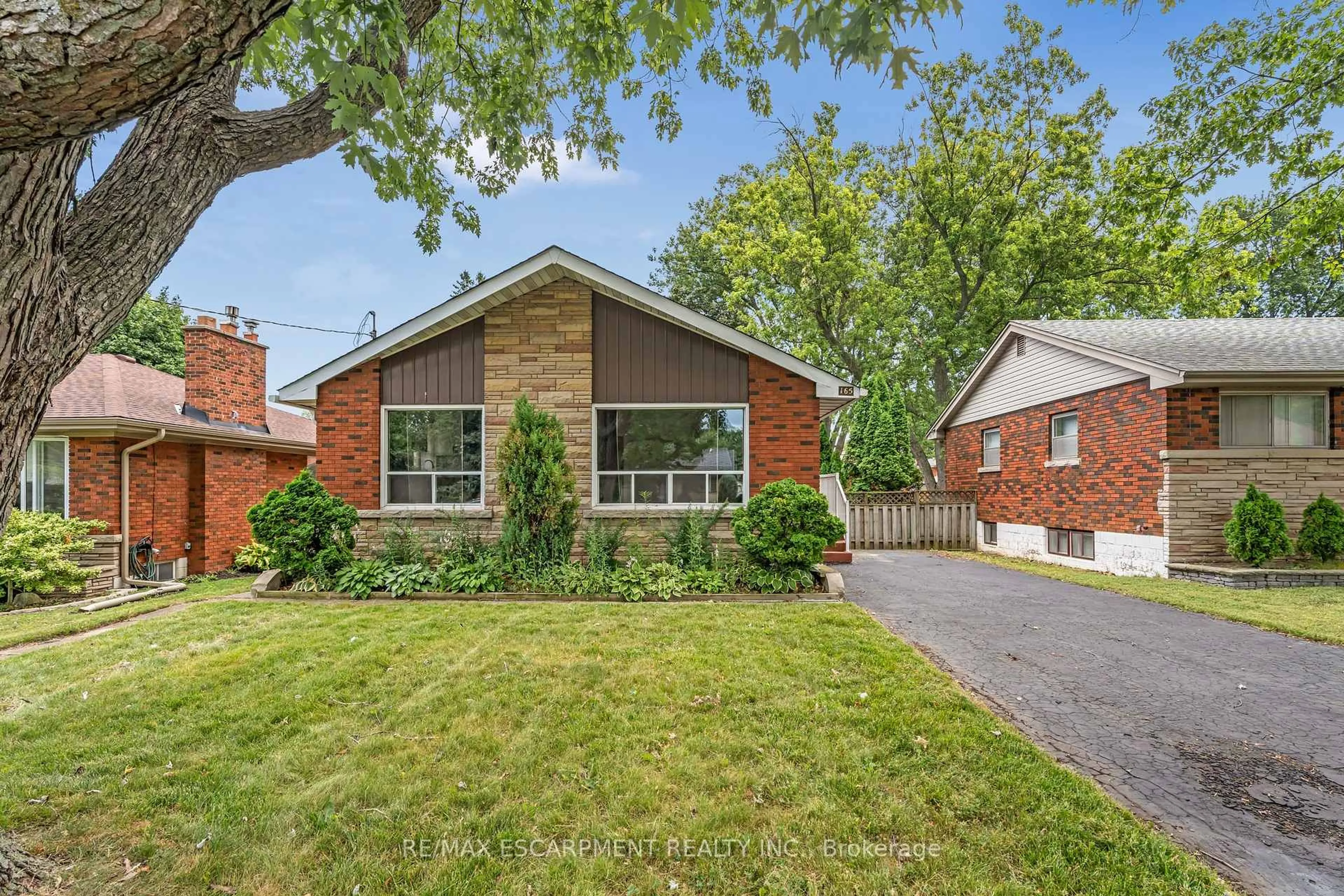 Home with brick exterior material, street for 165 WEST 27TH St, Hamilton Ontario L9C 5A5