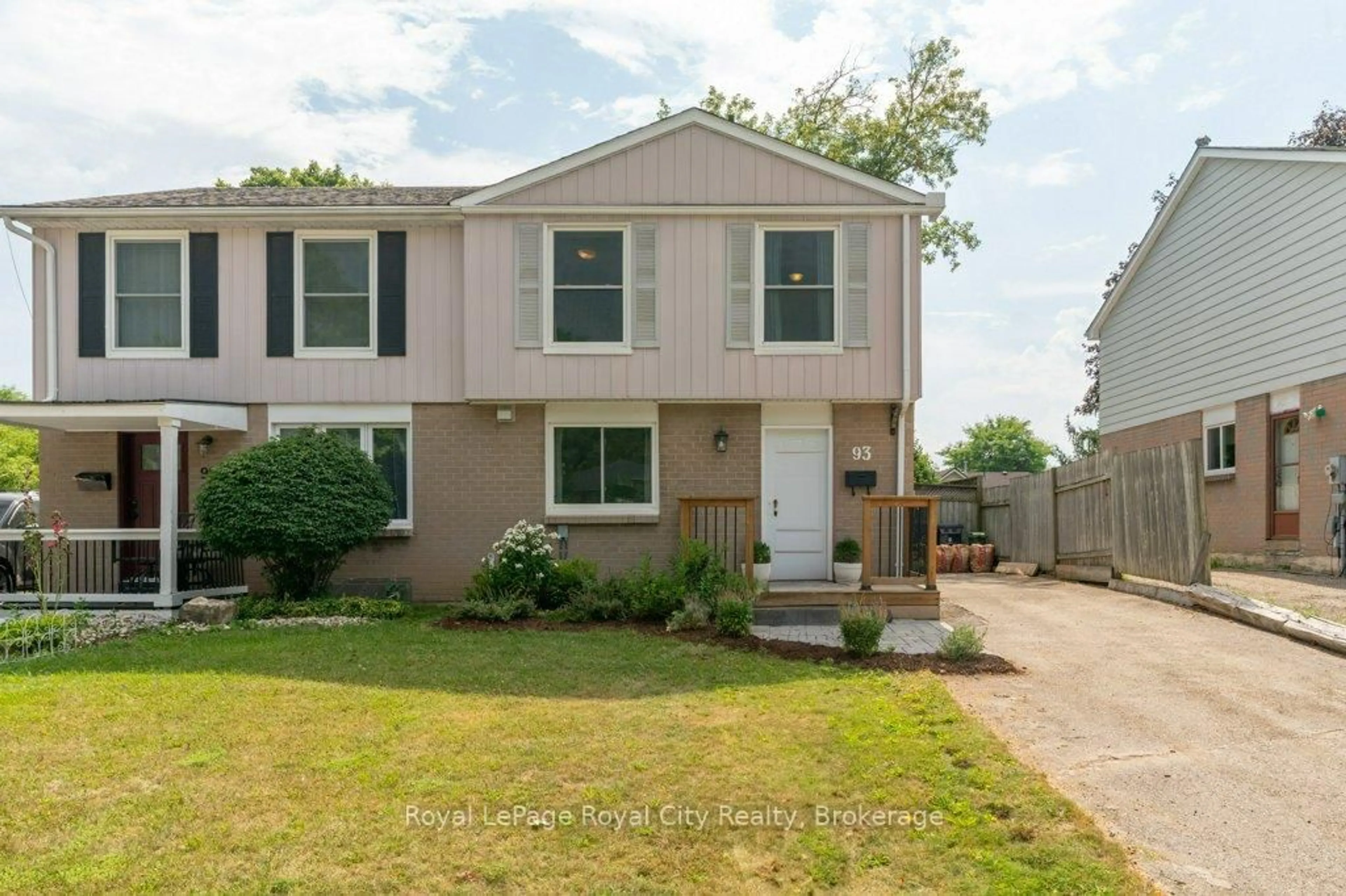 Home with vinyl exterior material, street for 93 Hadati Rd, Guelph Ontario N1E 6G9