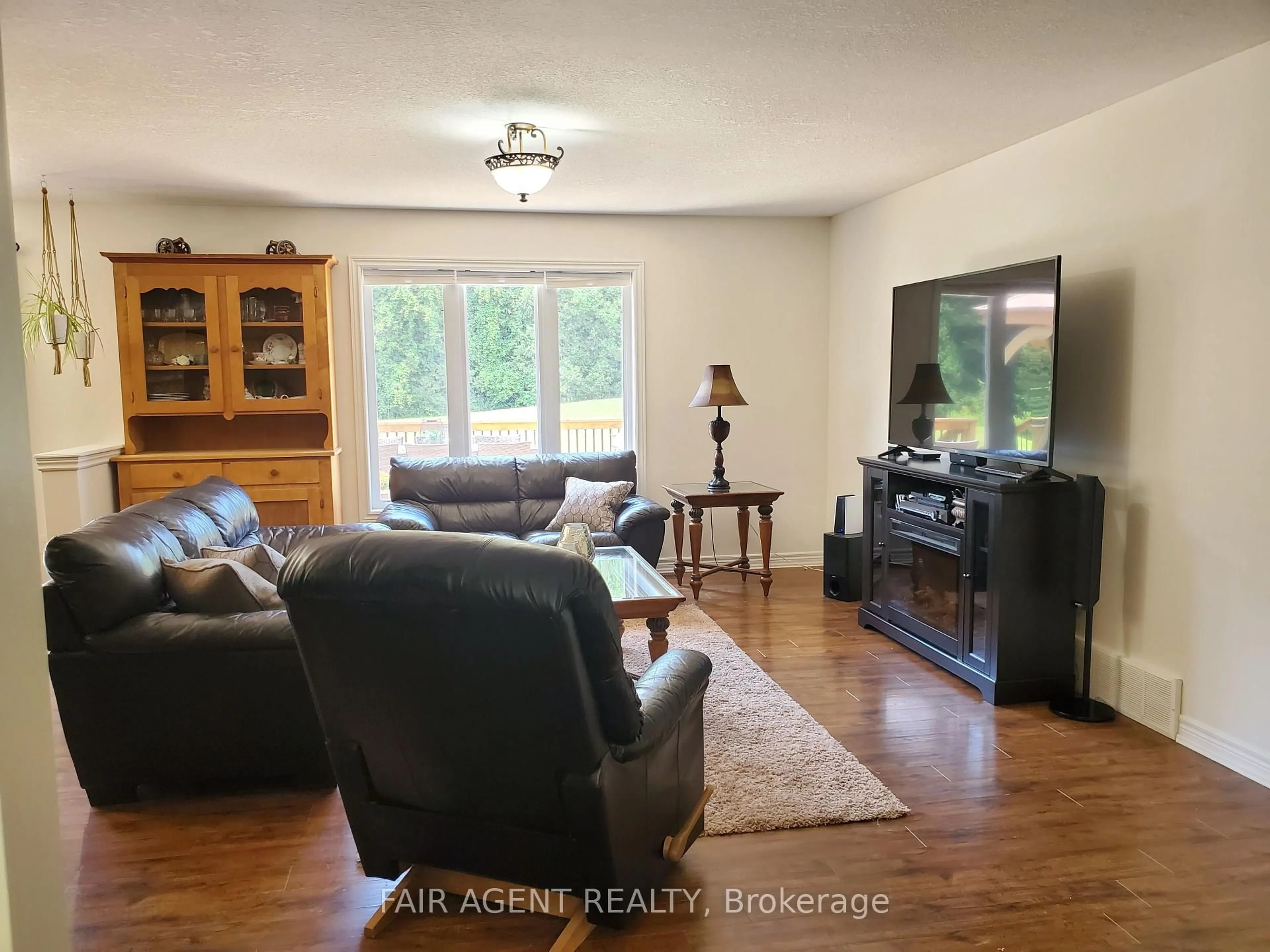 Living room with furniture, wood/laminate floor for 113 Scotts Hill Rd, West Grey Ontario N4N 3B8