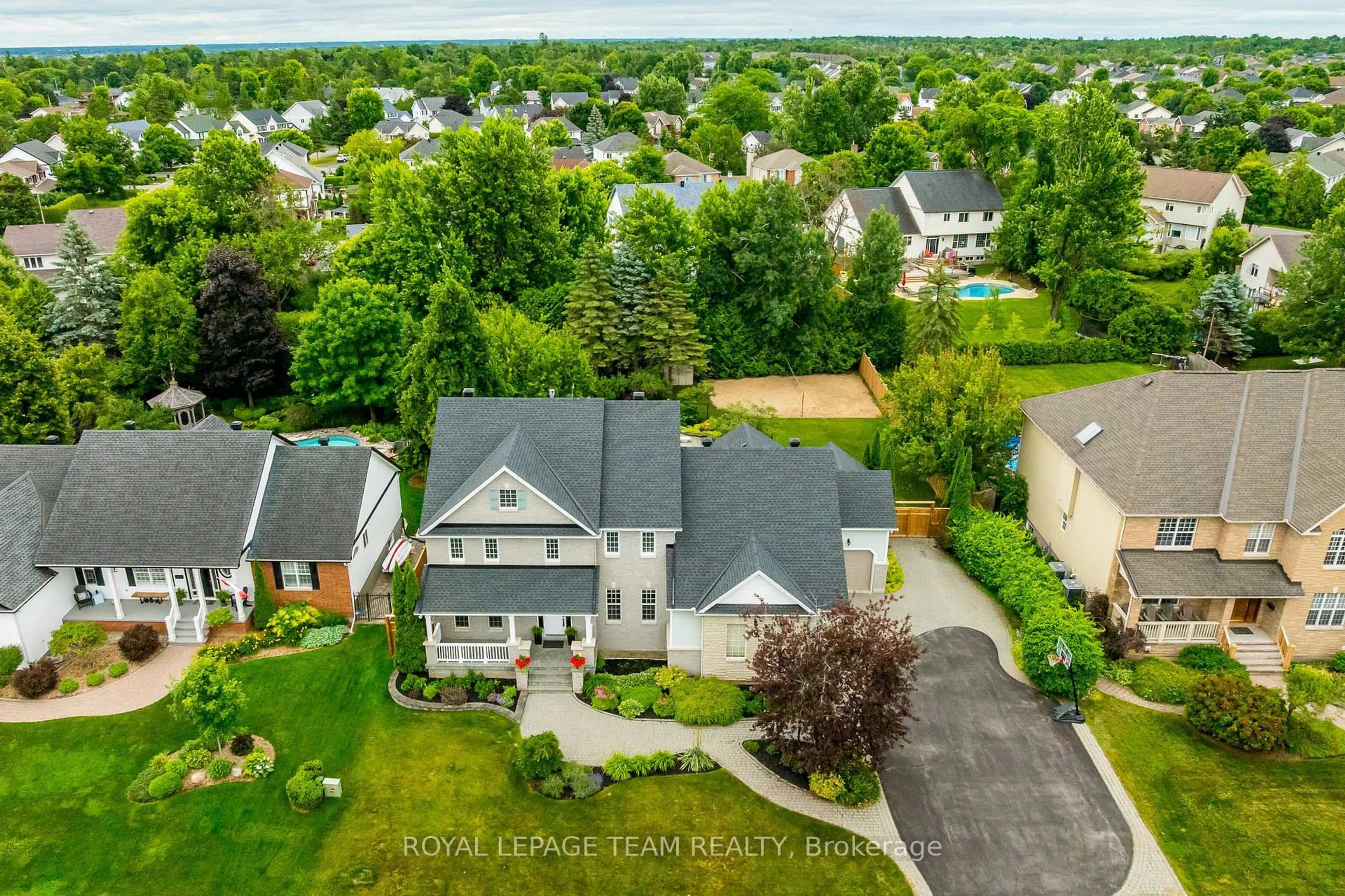 A pic from outside/outdoor area/front of a property/back of a property/a pic from drone, street for 10 Beechgrove Gdns, Stittsville Ontario K2S 1W5