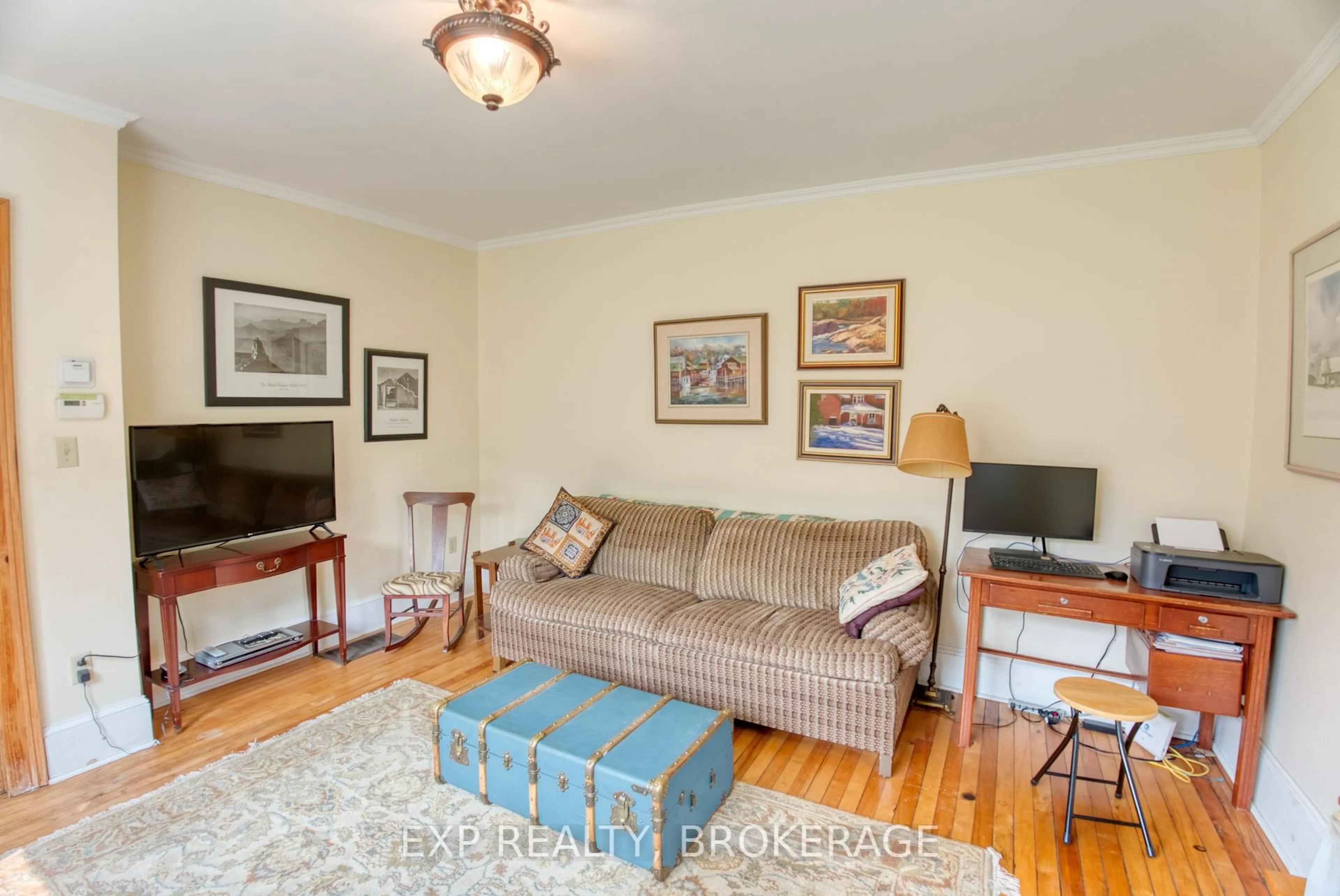 Living room with furniture, wood/laminate floor for 412 MCNAUGHTON Rd, Maberly Ontario K0H 2B0