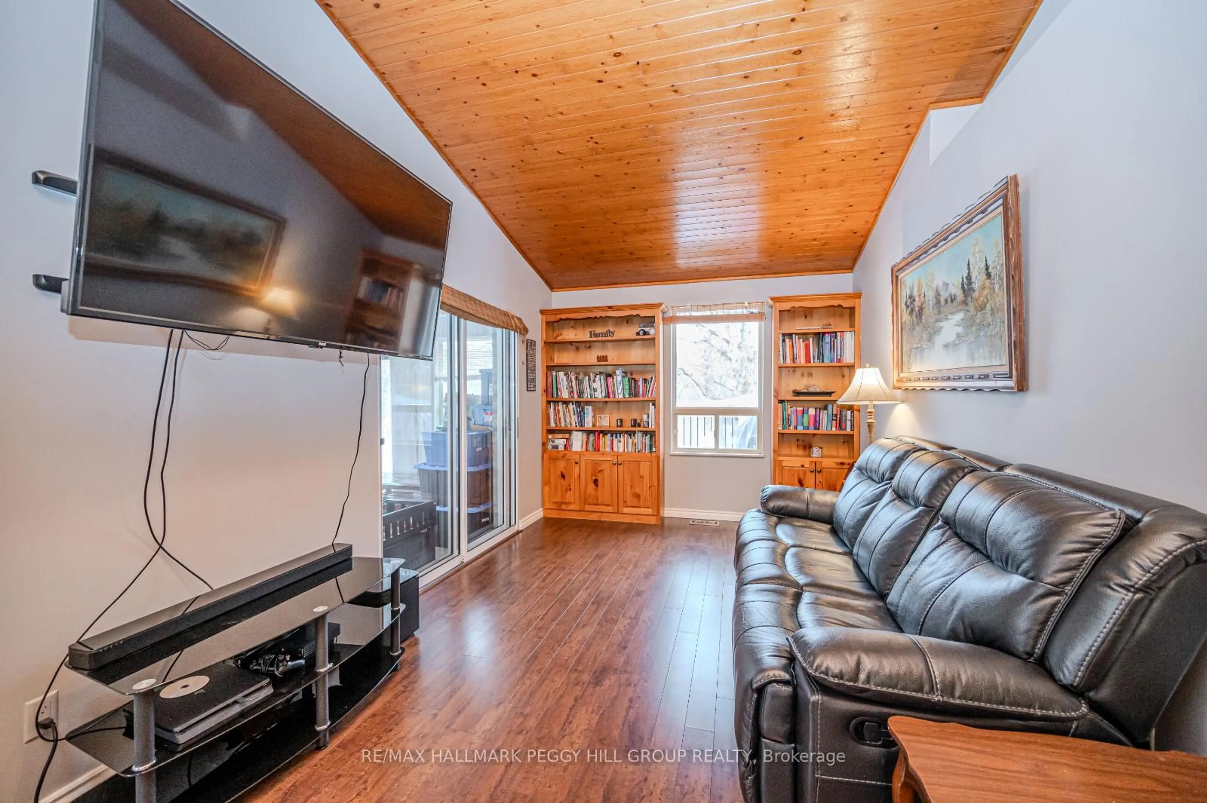 Living room with furniture, wood/laminate floor for 87 Corrievale Rd, Georgian Bay Ontario L0K 1S0