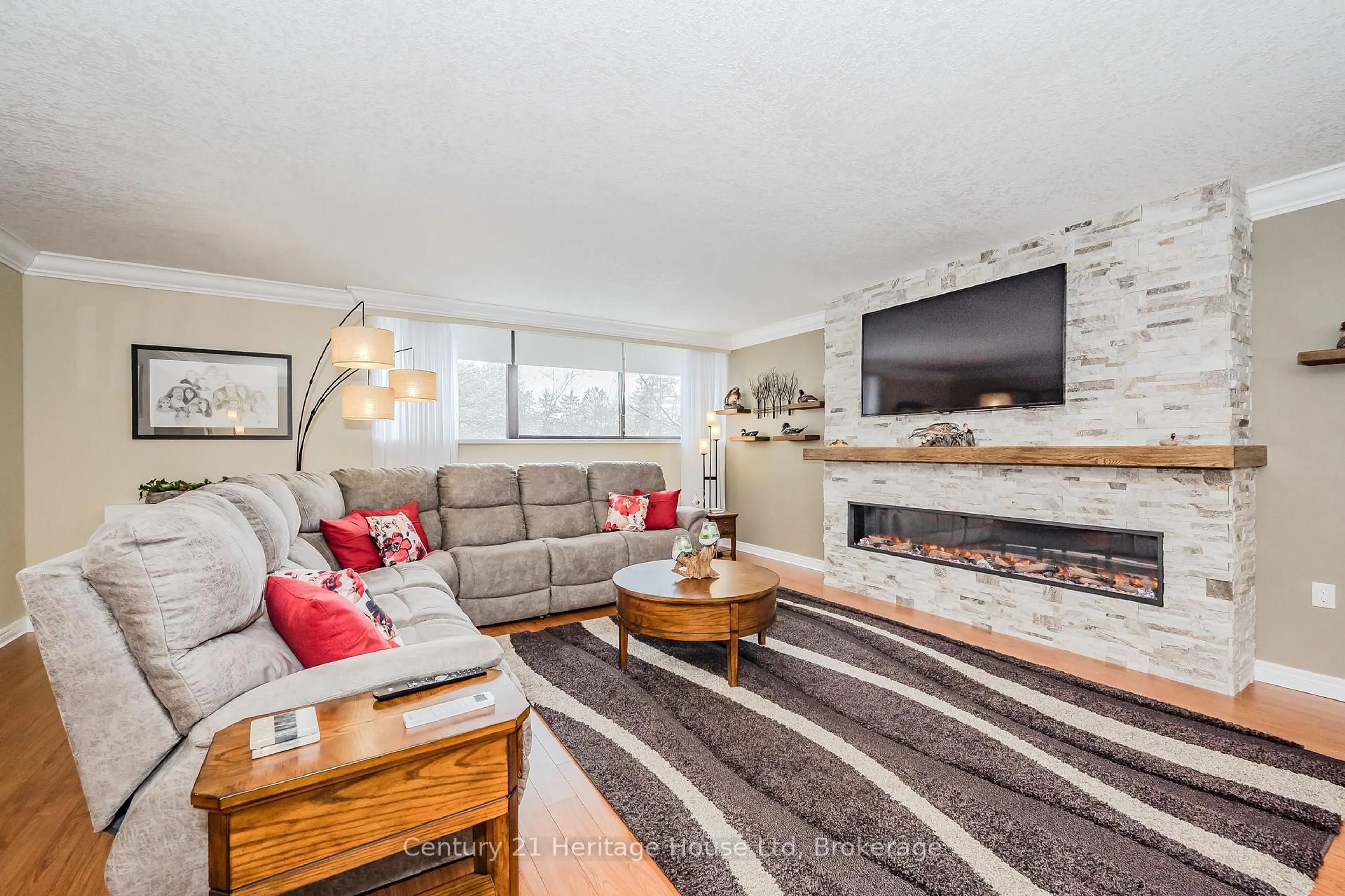 Living room with furniture, unknown for 93 Westwood Rd #306, Guelph Ontario N1H 7J7