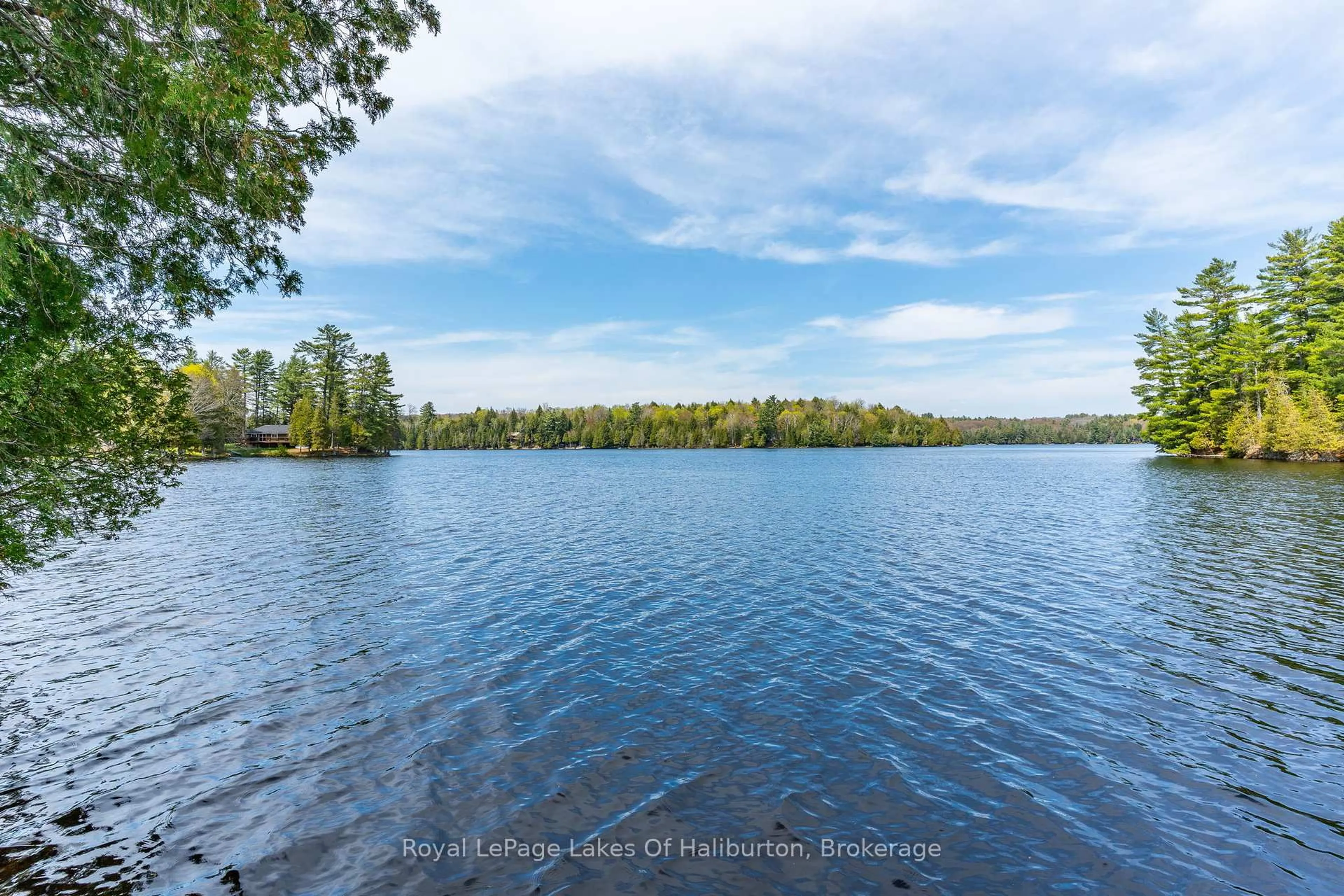 A pic from outside/outdoor area/front of a property/back of a property/a pic from drone, water/lake/river/ocean view for 1089 Pioneer Rd, Highlands East Ontario K0M 1R0