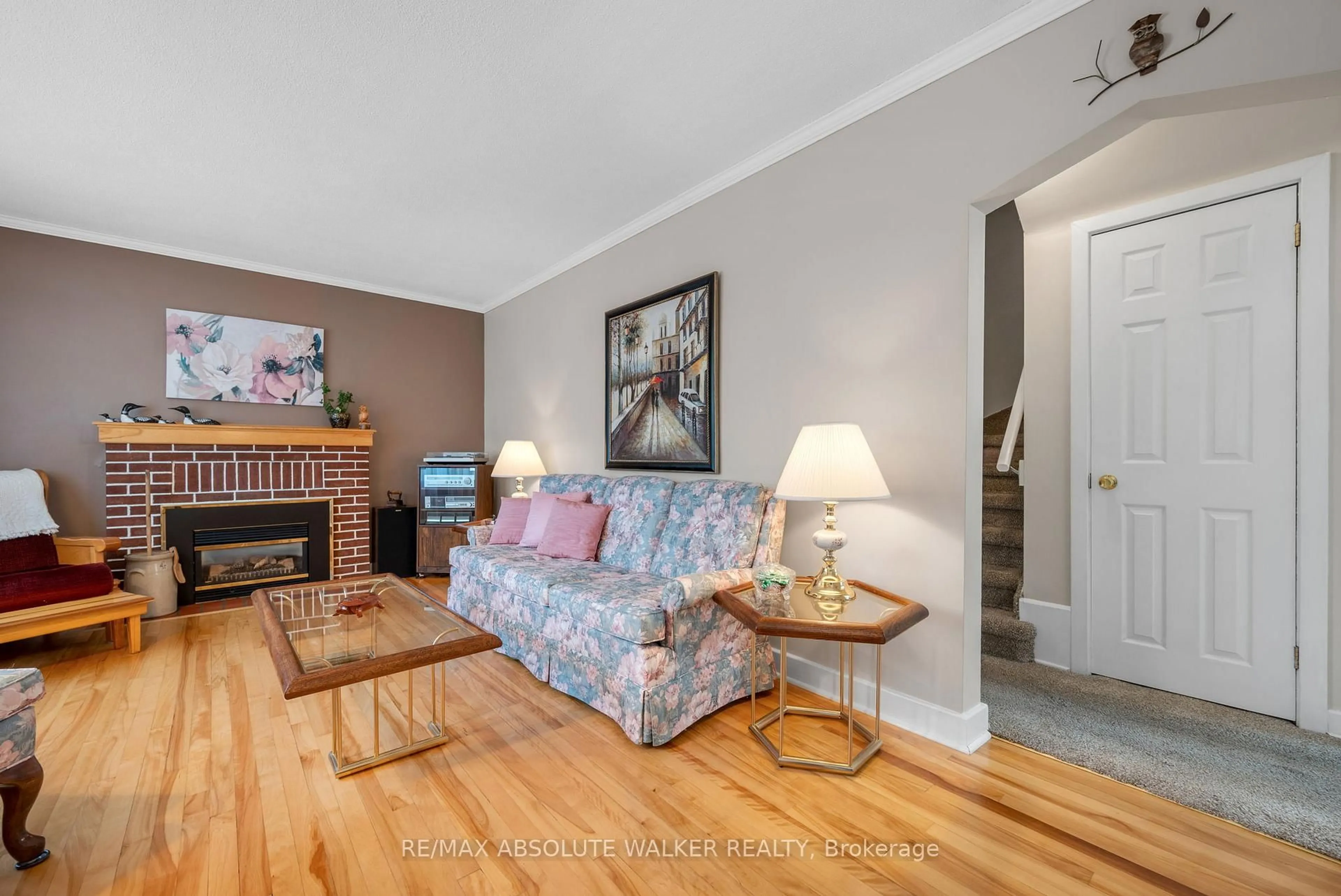 Living room with furniture, wood/laminate floor for 1354 Larose Ave, Ottawa Ontario K1Z 7X5