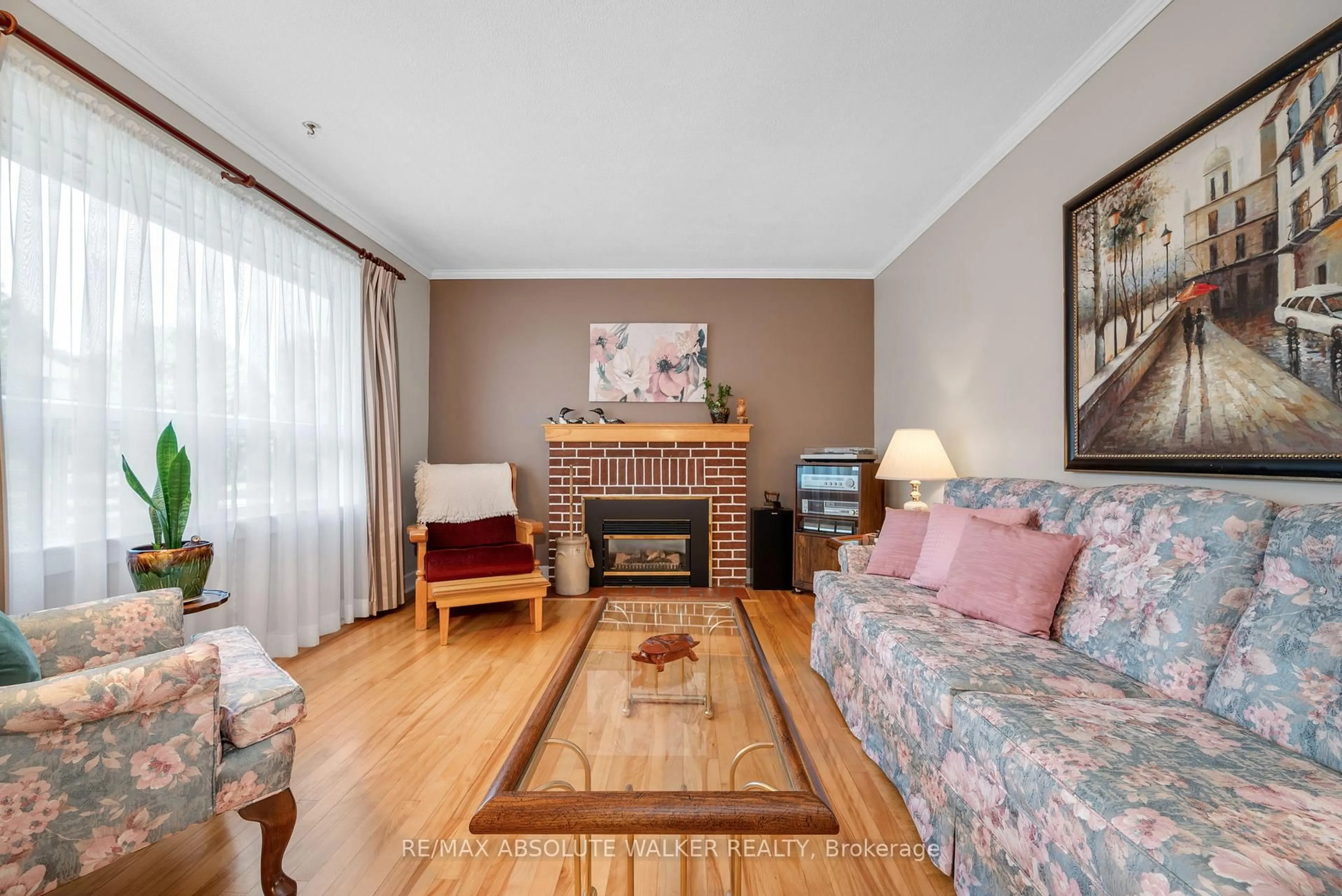 Living room with furniture, wood/laminate floor for 1354 Larose Ave, Ottawa Ontario K1Z 7X5