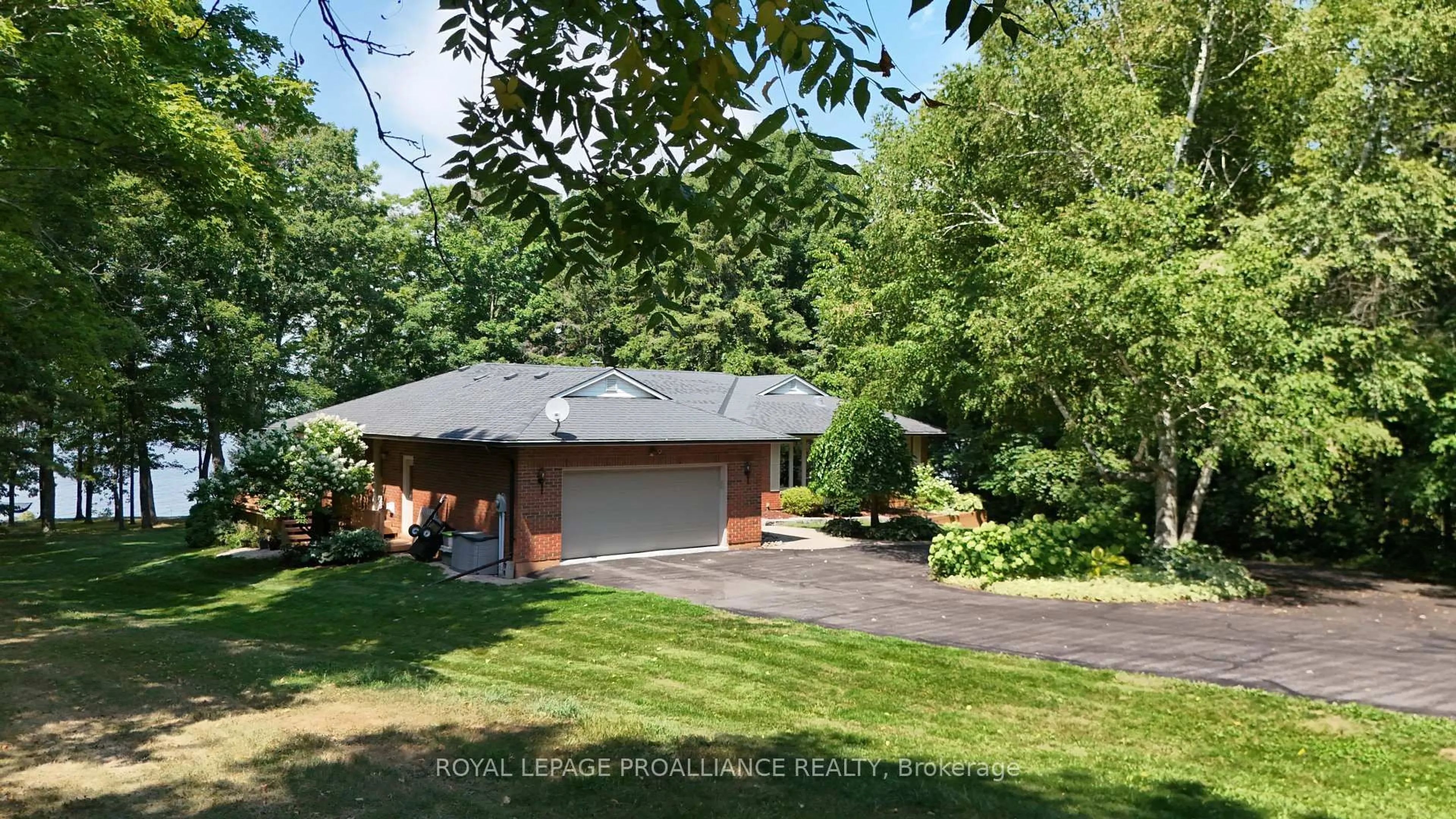 A pic from outside/outdoor area/front of a property/back of a property/a pic from drone, street for 1712 County Rd 3, Prince Edward County Ontario K0K 1L0