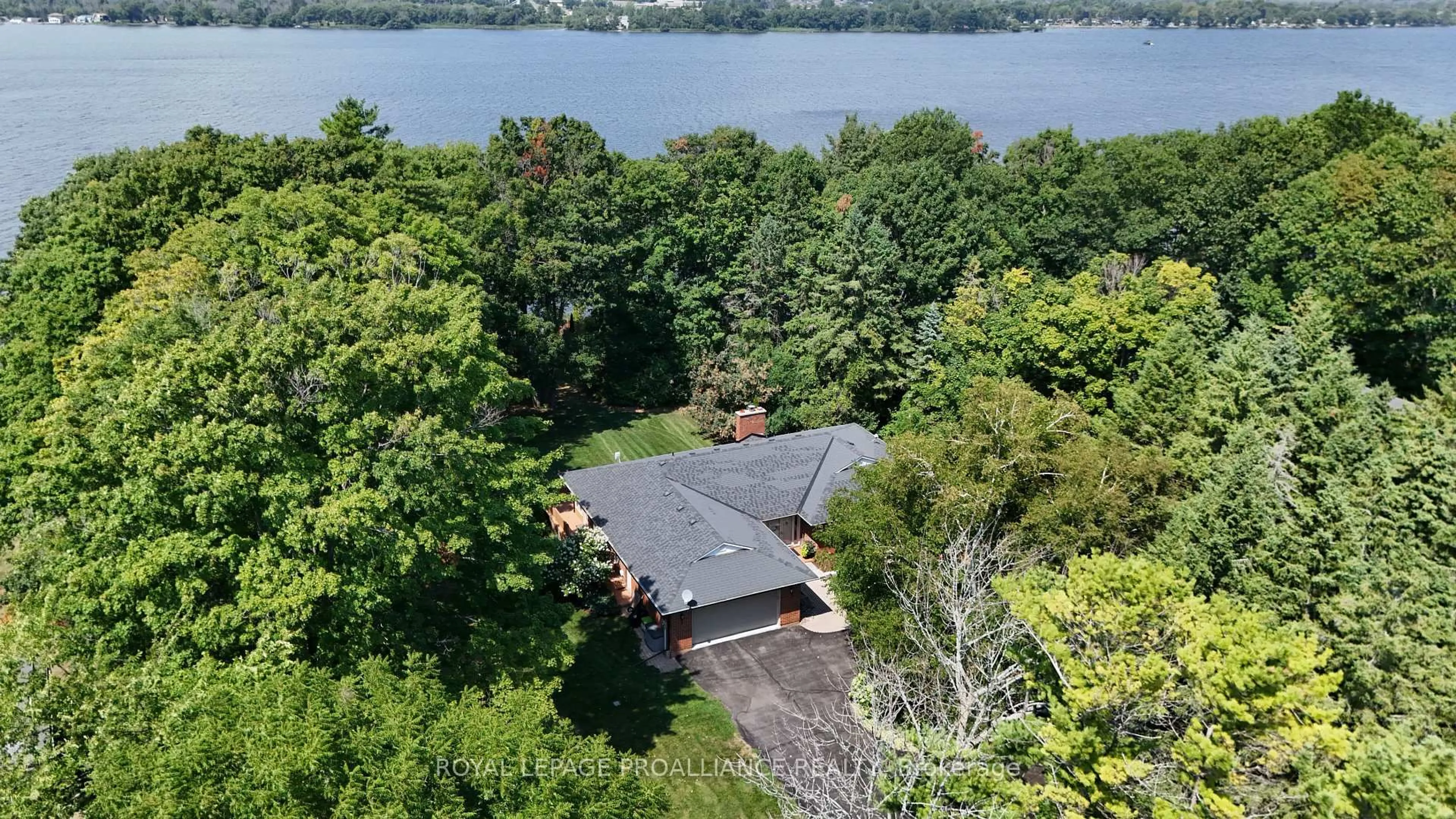 A pic from outside/outdoor area/front of a property/back of a property/a pic from drone, water/lake/river/ocean view for 1712 County Rd 3, Prince Edward County Ontario K0K 1L0