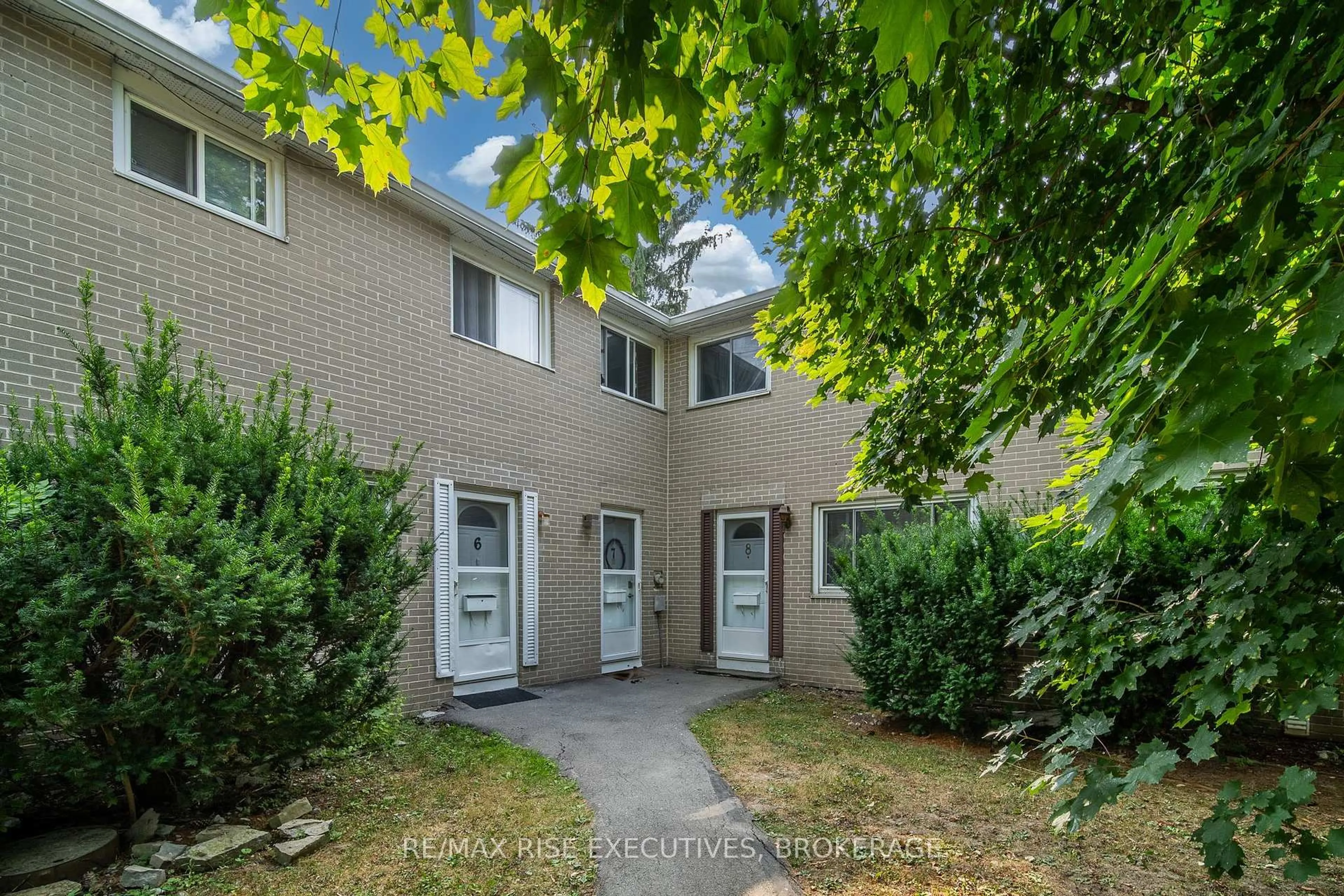 A pic from outside/outdoor area/front of a property/back of a property/a pic from drone, street for 258 Queen Mary Rd #8, Kingston Ontario K7M 2B2