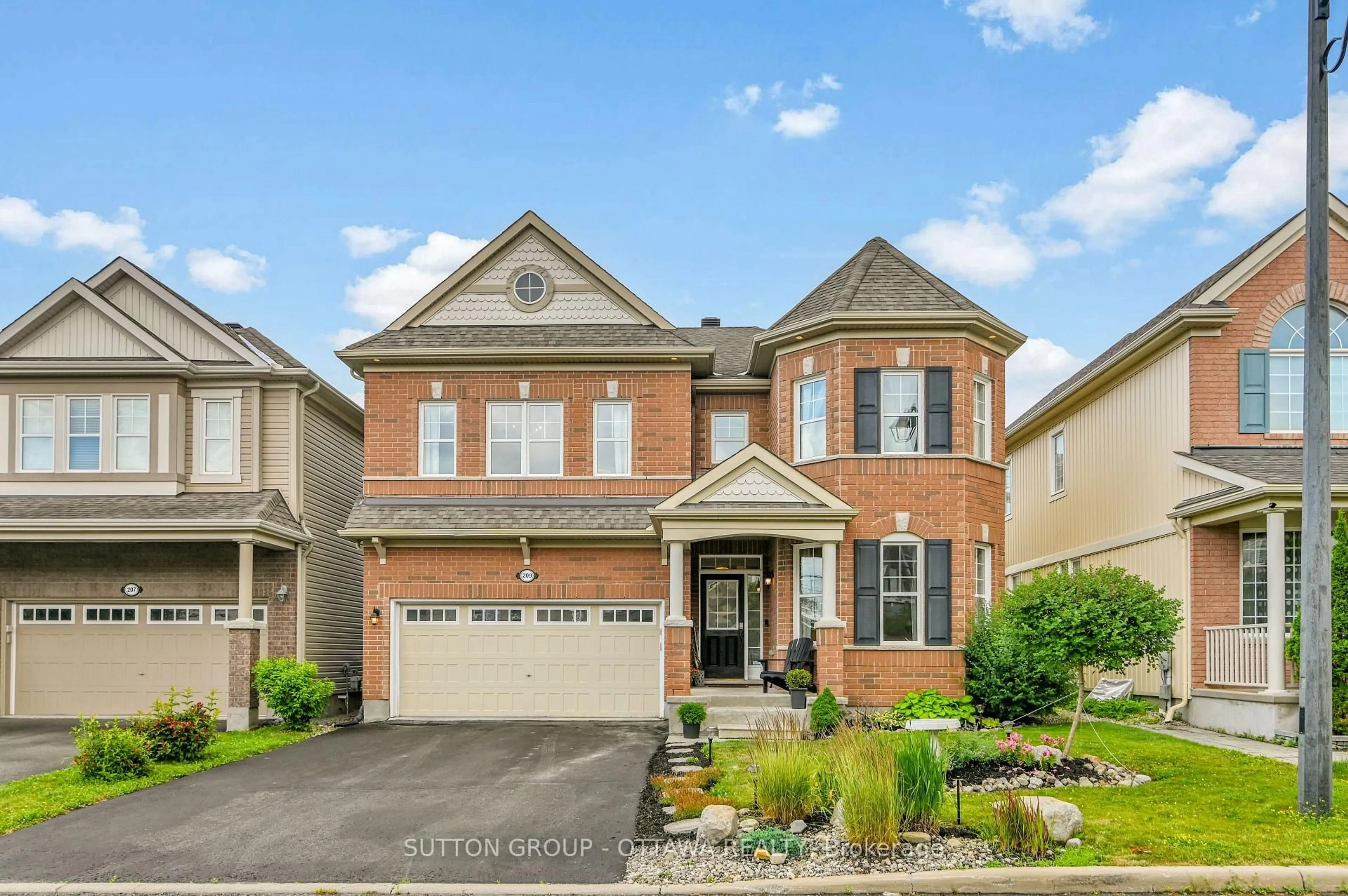 Home with brick exterior material, street for 209 Dutchmans Way, Ottawa Ontario K2J 5W5