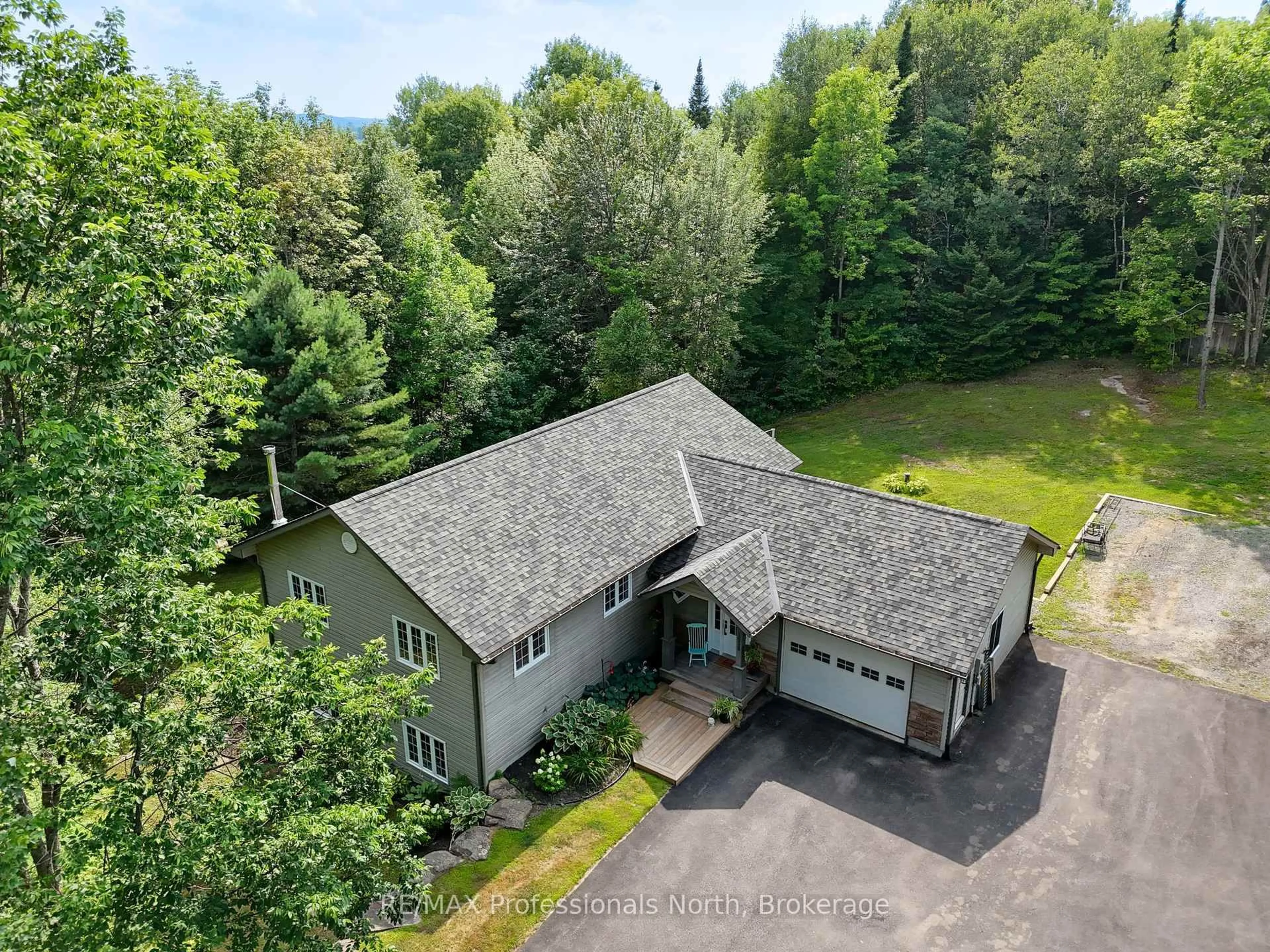 A pic from outside/outdoor area/front of a property/back of a property/a pic from drone, unknown for 1658 60 Highway, Huntsville Ontario P1H 1A2