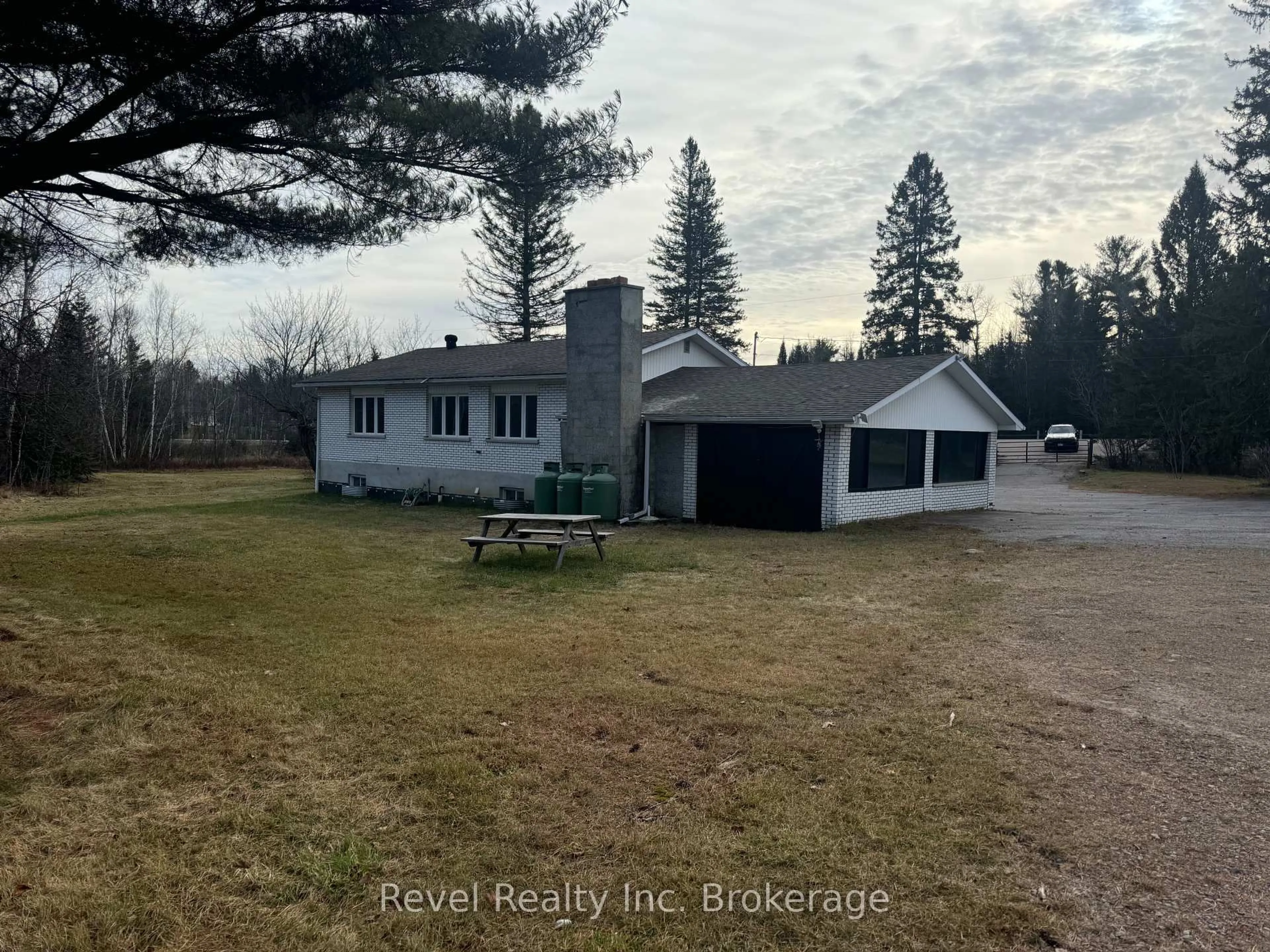 A pic from outside/outdoor area/front of a property/back of a property/a pic from drone, unknown for 3877 17 Highway, Papineau-Cameron Ontario P0H 1V0