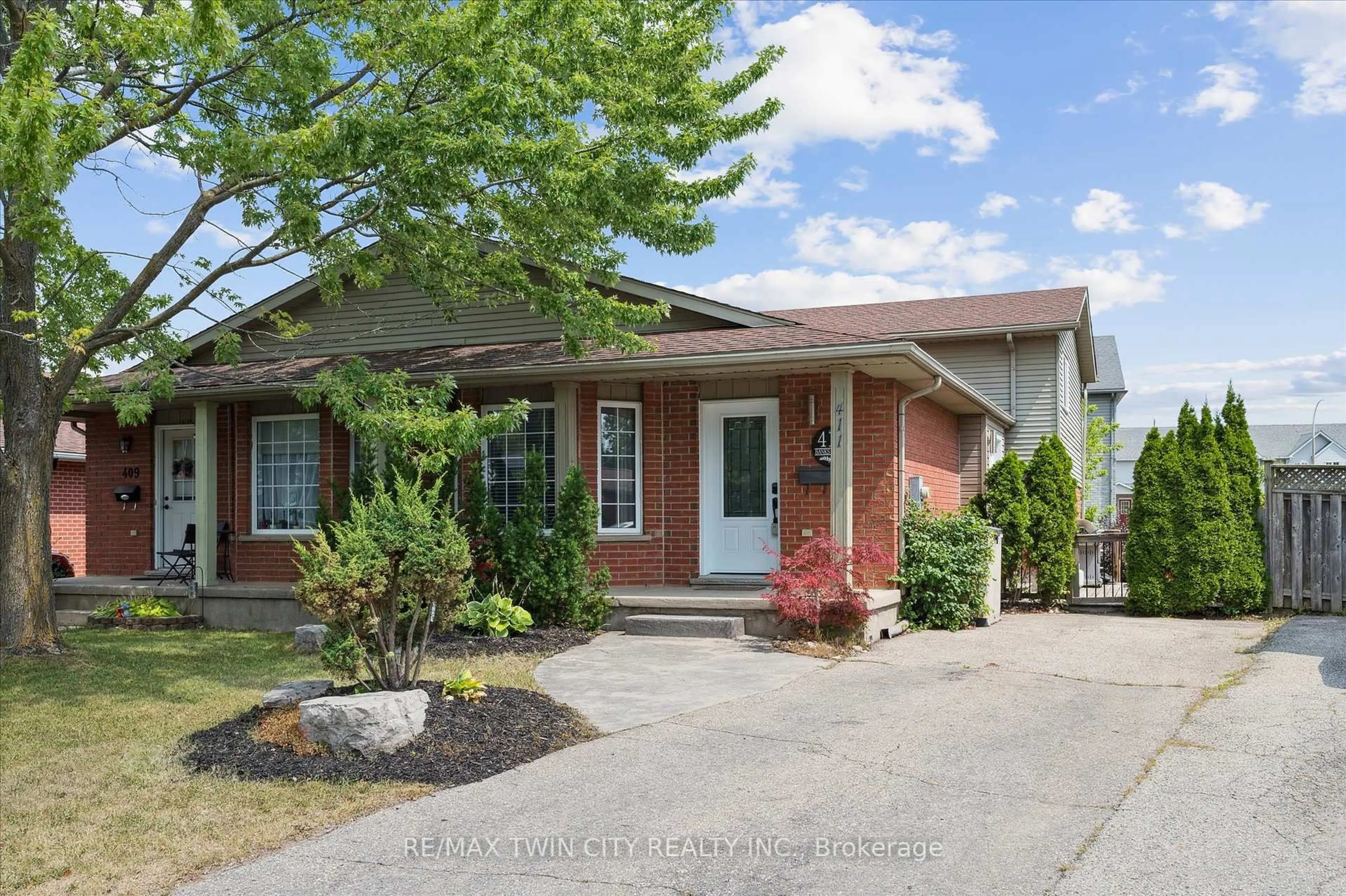 Home with brick exterior material, street for 411 Bankside Cres, Kitchener Ontario N2N 3E5