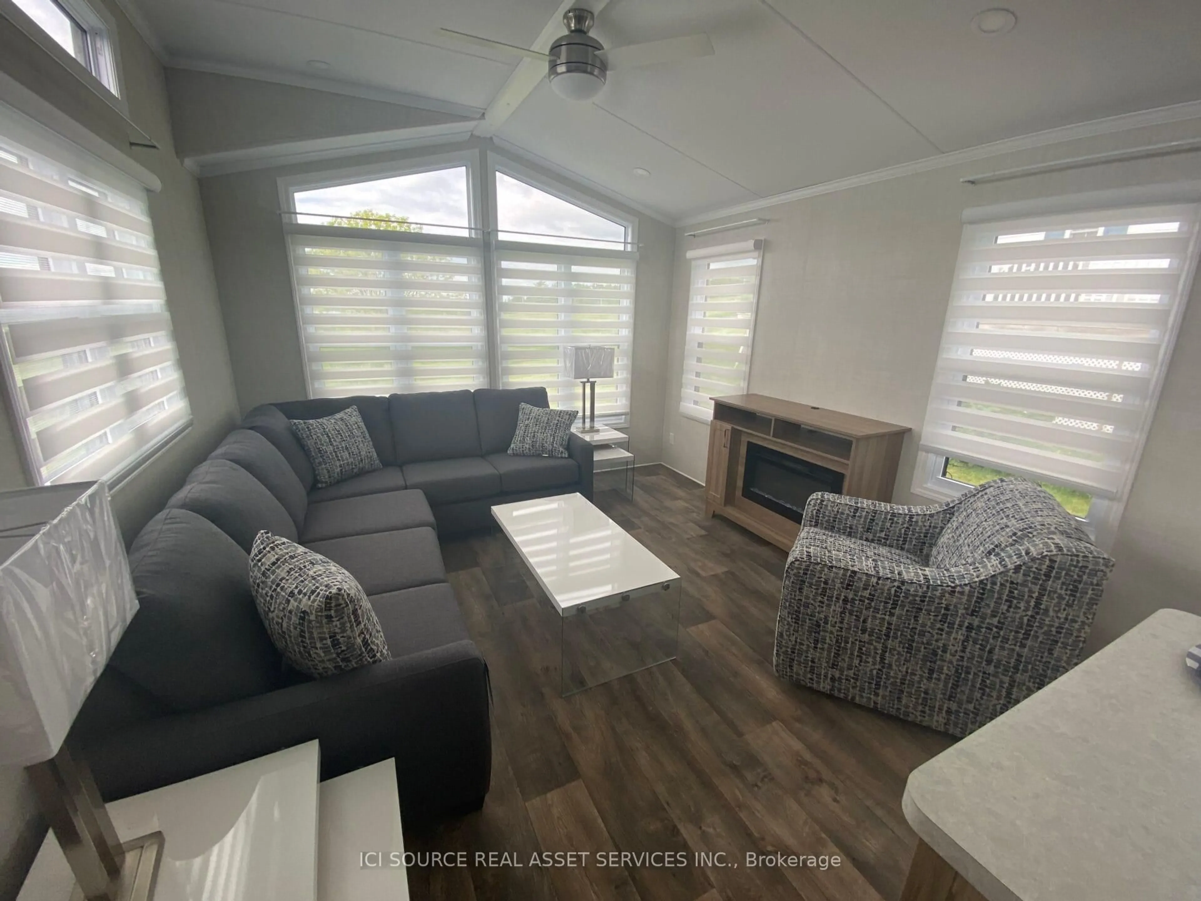 Living room with furniture, wood/laminate floor for 1336 S Morrison Lake Rd #TRILM, Gravenhurst Ontario P0E 1G0