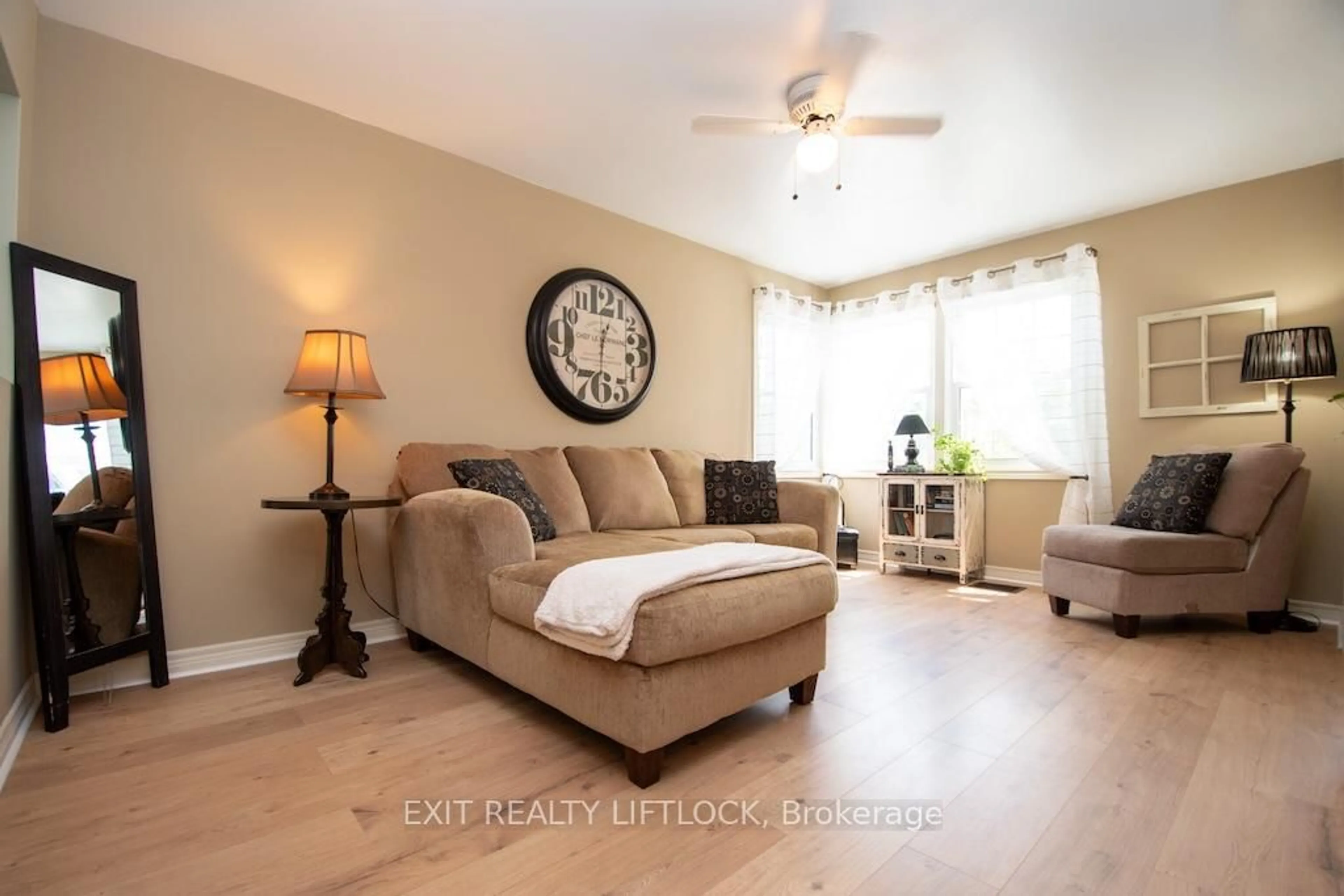 Living room with furniture, wood/laminate floor for 26 Victoria Ave, Peterborough North Ontario K9H 4V7